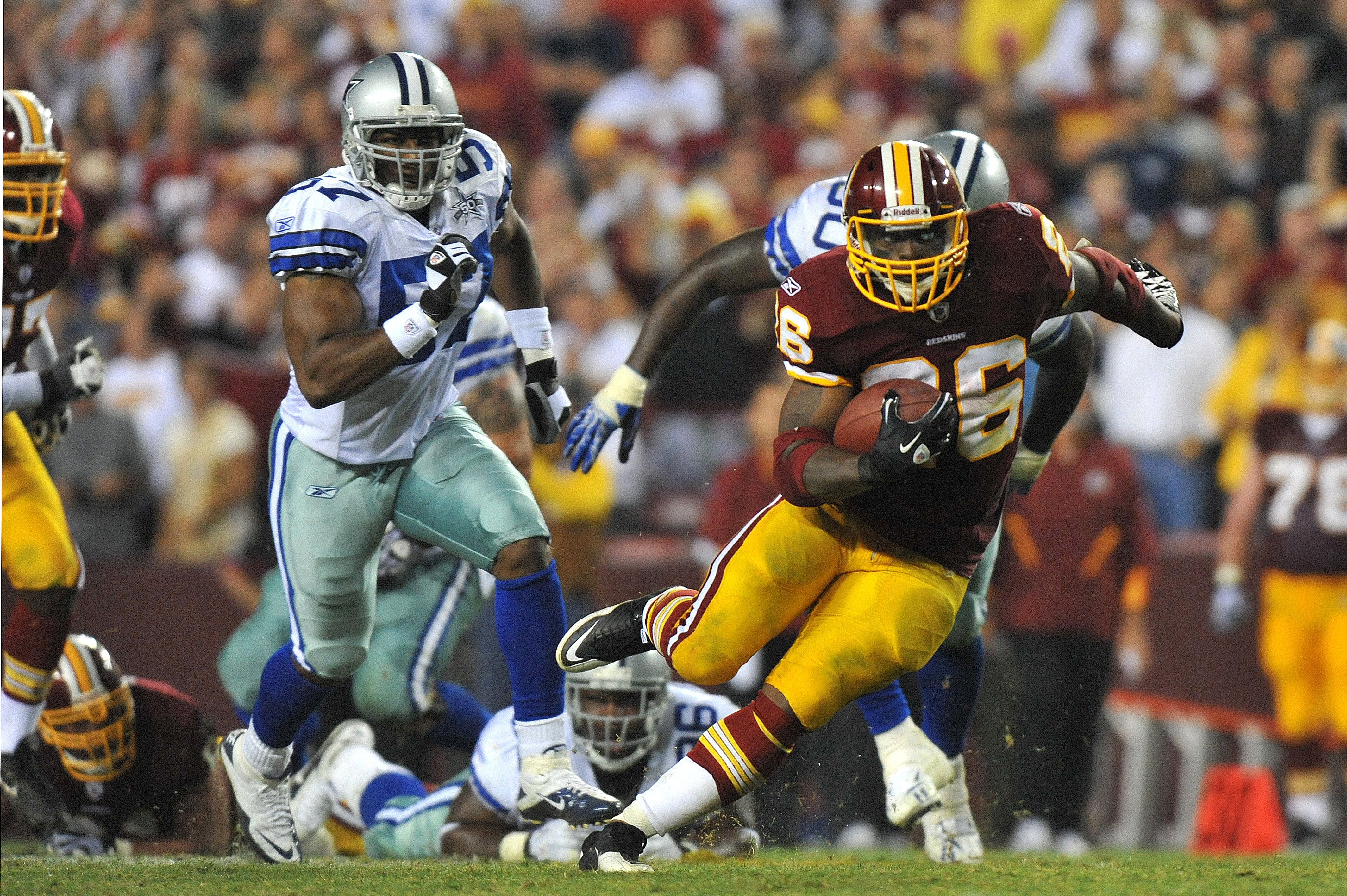 LANDOVER - SEPTEMBER 12: Clinton Portis #26 of the Washington Redskins runs the ball during the NFL season opener against the Dallas Cowboys at FedExField on September 12, 2010 in Landover, Maryland. The Redskins defeated the Cowboys 13-7. (Photo by Larr LANDOVER - SEPTEMBER 12: Clinton Portis #26 of the Washington Redskins runs the ball during the NFL season opener against the Dallas Cowboys at FedExField on September 12, 2010 in Landover, Maryland. The Redskins defeated the Cowboys 13-7. (Photo by Larr
