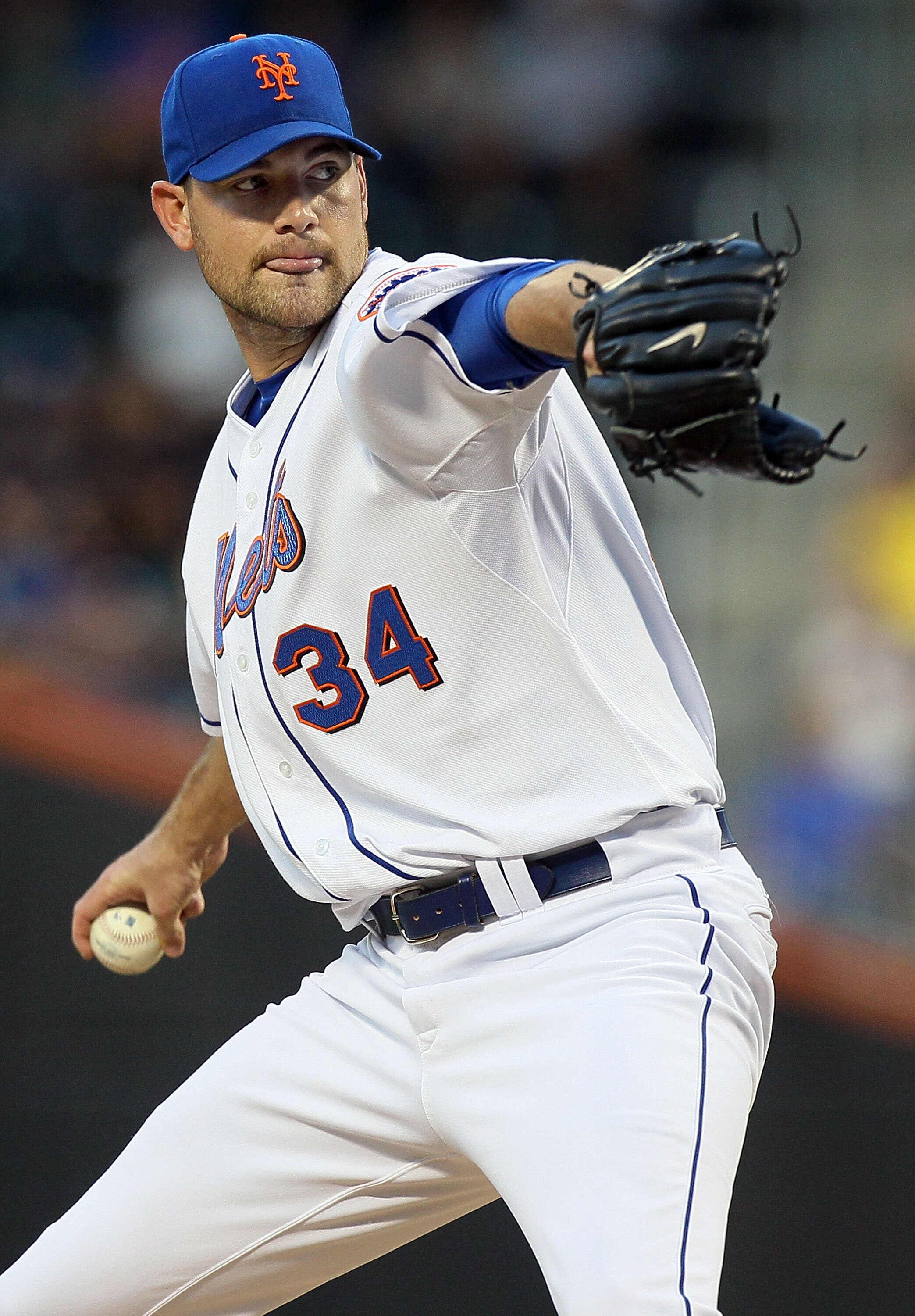 NEW YORK - AUGUST 27:  Mike Pelfrey #34 of the New York Mets delivers a pitch against the Houston Astros on August 27, 2010 at Citi Field in the Flushing neighborhood of the Queens borough of New York City.  (Photo by Jim McIsaac/Getty Images)