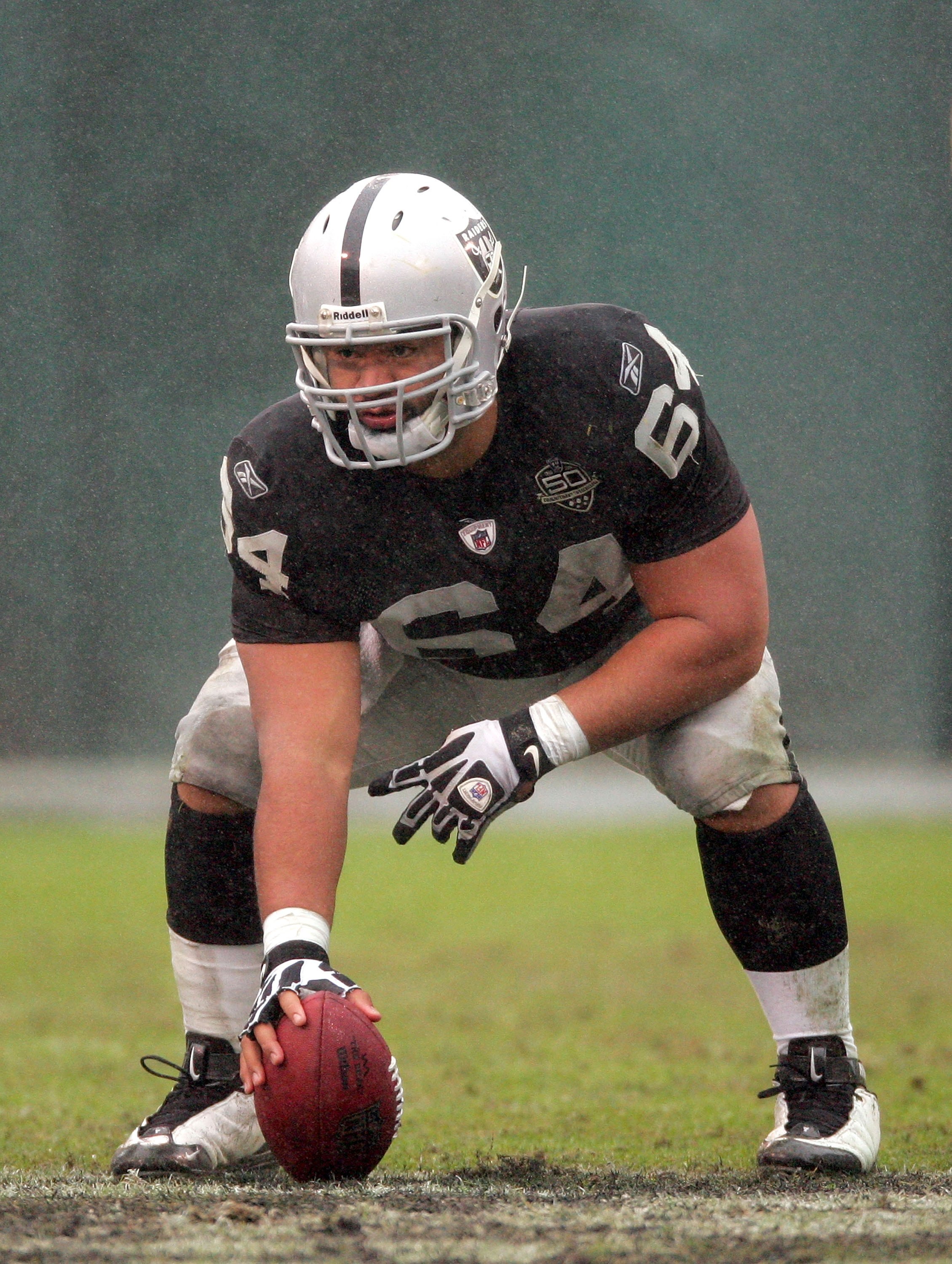 OAKLAND, CA - DECEMBER 13: Samson Satele #64 of the Oakland Raiders gets set to snap the ball during their game against the Washington Redskins at Oakland-Alameda County Coliseum on December 13, 2009 in Oakland, California.  (Photo by Ezra Shaw/Getty Imag