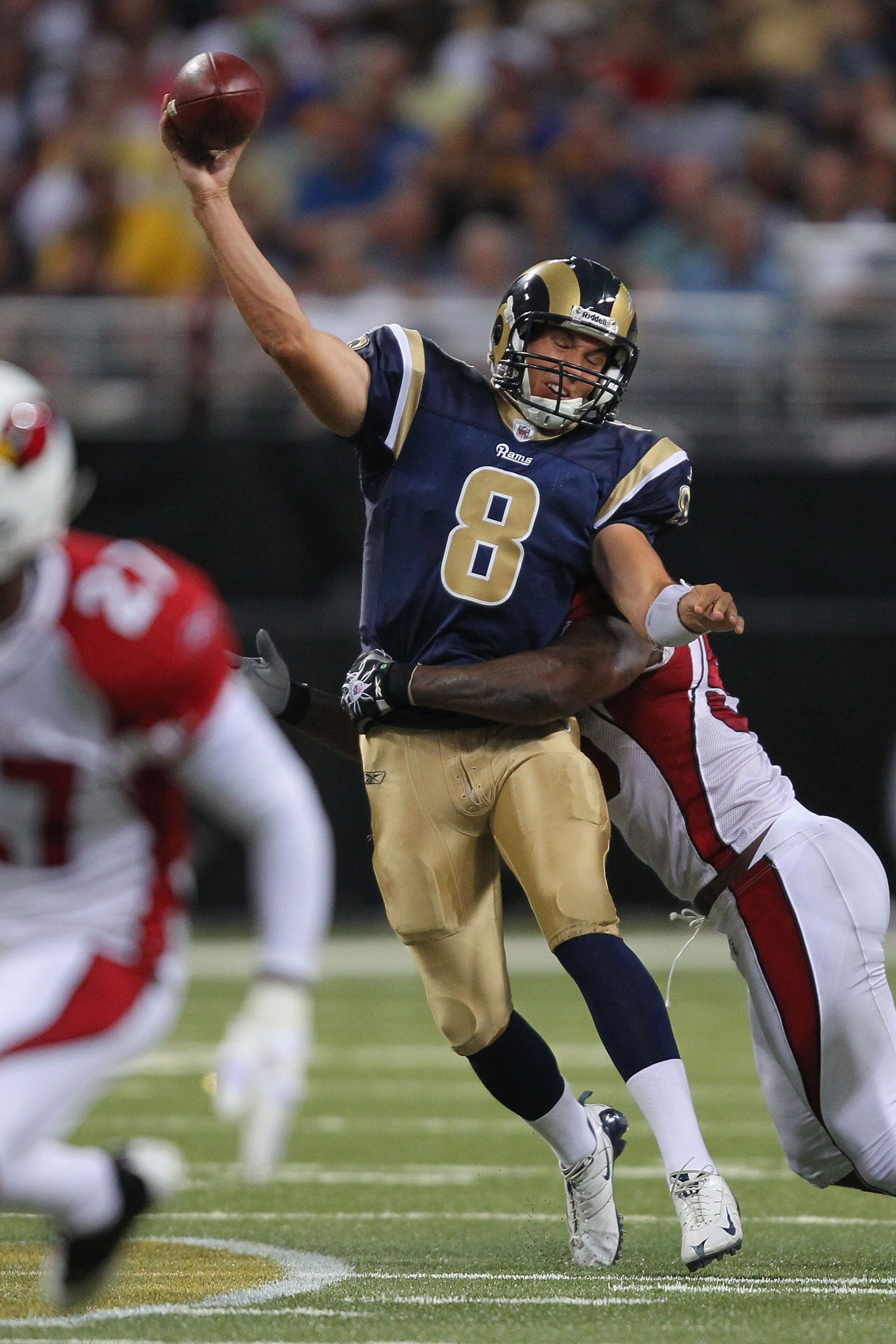 ST. LOUIS - SEPTEMBER 12: Sam Bradford #8 of the St. Louis Rams is sacked against the Arizona Cardinals during the NFL season opener at the Edward Jones Dome on September 12, 2010 in St. Louis, Missouri.  The Cardinals beat the Rams 17-13.  (Photo by Dili