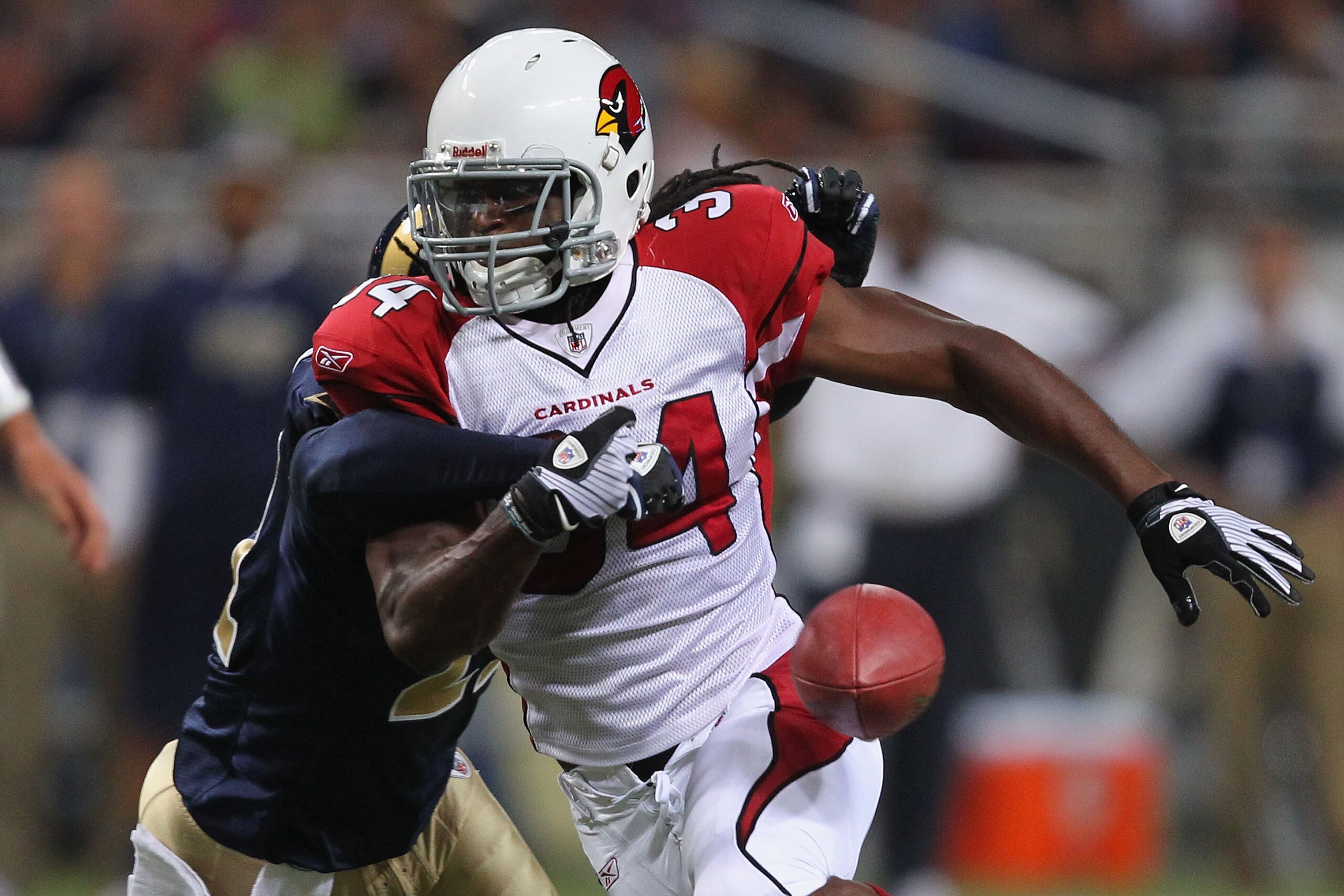 ST. LOUIS - SEPTEMBER 12: Tim Hightower #34 of the Arizona Cardinals has the ball stripped from him during the NFL season opener against the St. Louis Rams at the Edward Jones Dome on September 12, 2010 in St. Louis, Missouri.  The Cardinals beat the Rams