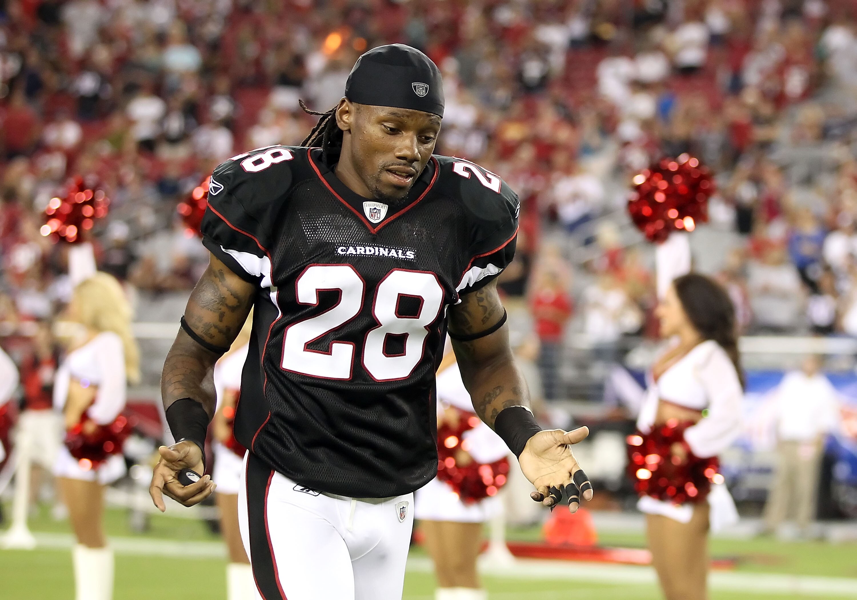 GLENDALE, AZ - SEPTEMBER 02:  Cornerback Greg Toler #28 of the Arizona Cardinals runs onto the field before the preseason NFL game against the Washington Redskins at the University of Phoenix Stadium on September 2, 2010 in Glendale, Arizona.  The Cardina
