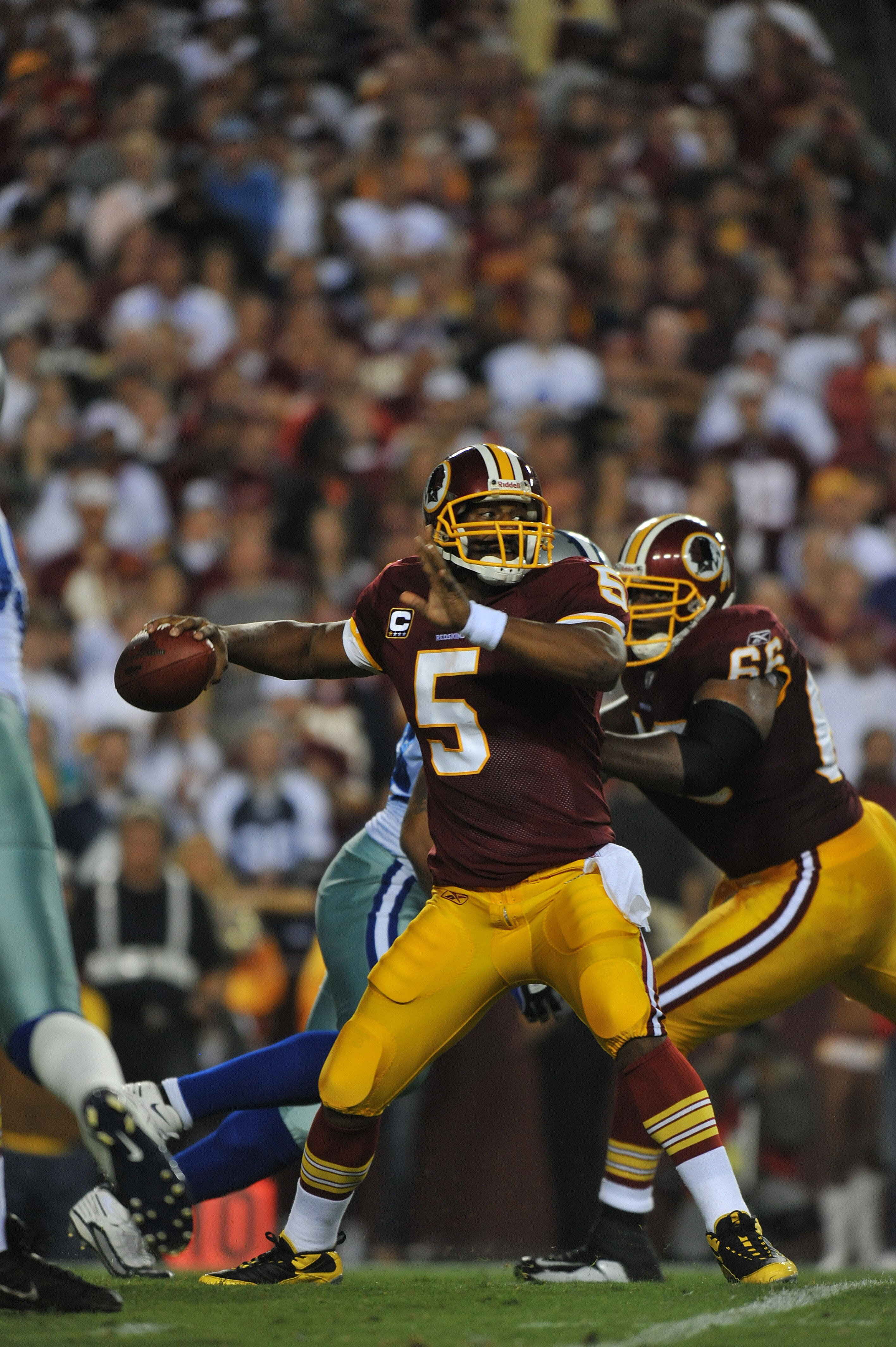 LANDOVER - SEPTEMBER 12:  Donovan McNabb #5 of the Washington Redskins passes during the NFL season opener against the Dallas Cowboys at FedExField on September 12, 2010 in Landover, Maryland. The Redskins defeated the Cowboys 13-7. (Photo by Larry French
