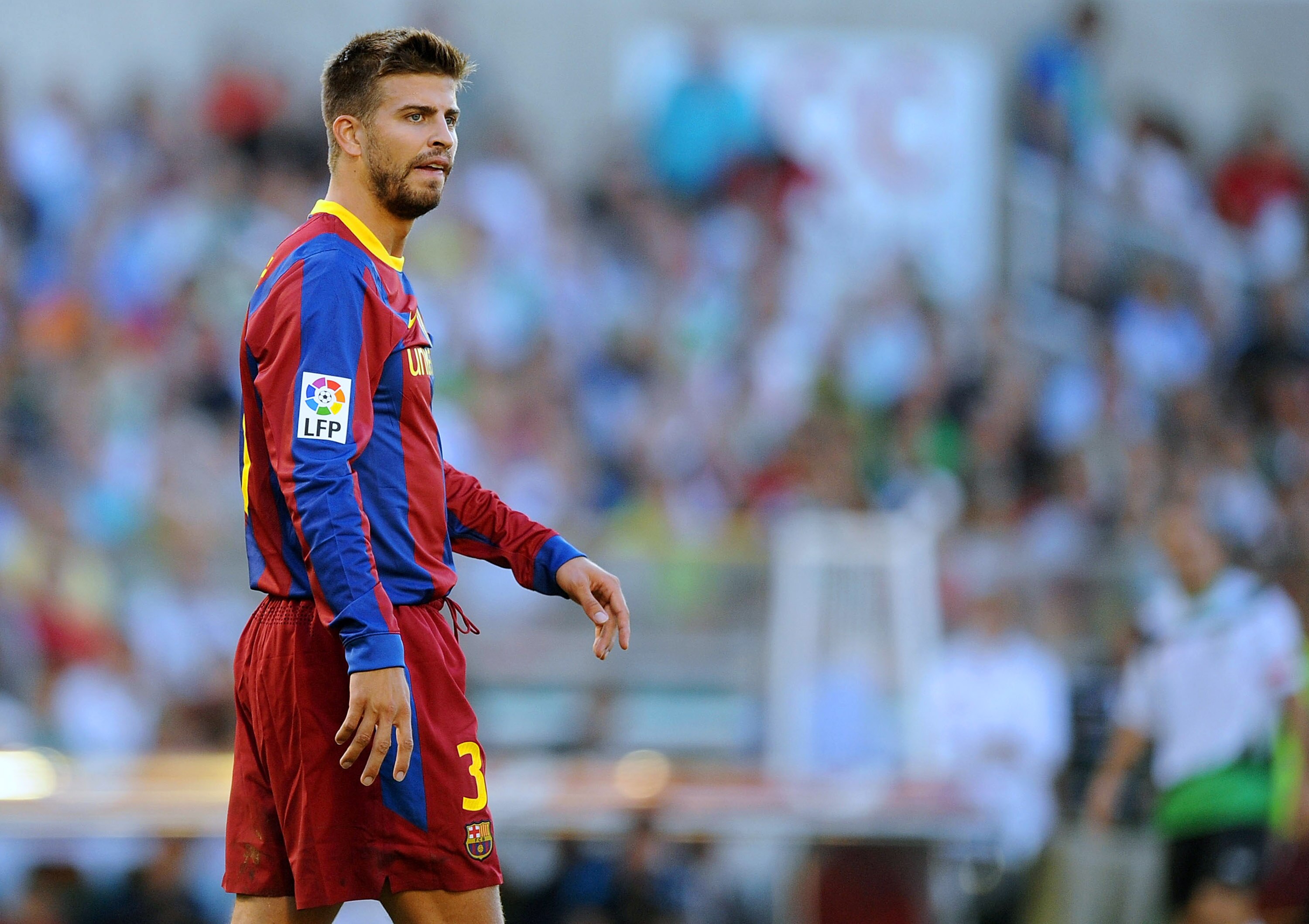 SANTANDER, SPAIN - AUGUST 29:  Gerard Pique of Barcelona waits for play to resume during the La Liga match between Racing Santander and Barcelona at El Sardinero stadium on August 29, 2010 in Santander, Spain.  (Photo by Denis Doyle/Getty Images)