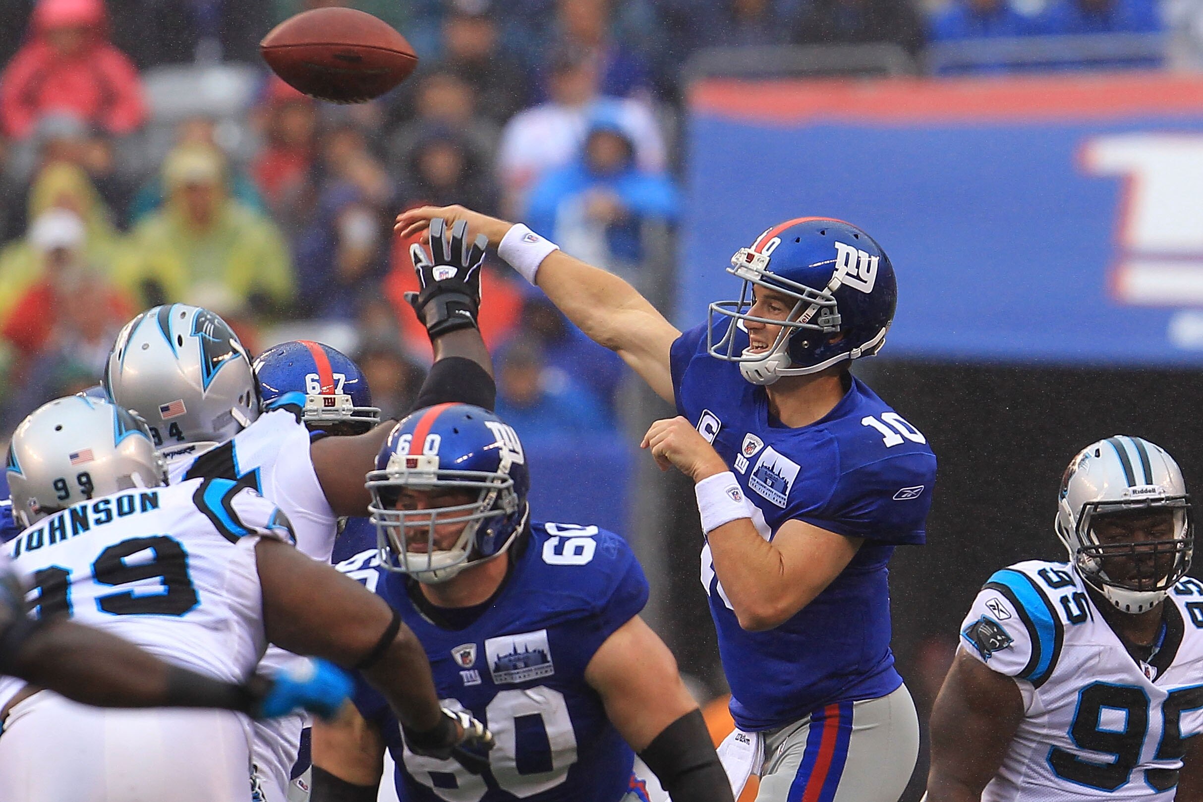 EAST RUTHERFORD, NJ - SEPTEMBER 12:  Eli Manning #10 of the New York Giants throws a pass against the Carolina Panthers during the NFL season opener at New Meadowlands Stadium on September 12, 2010 in East Rutherford, New Jersey.  (Photo by Chris McGrath/