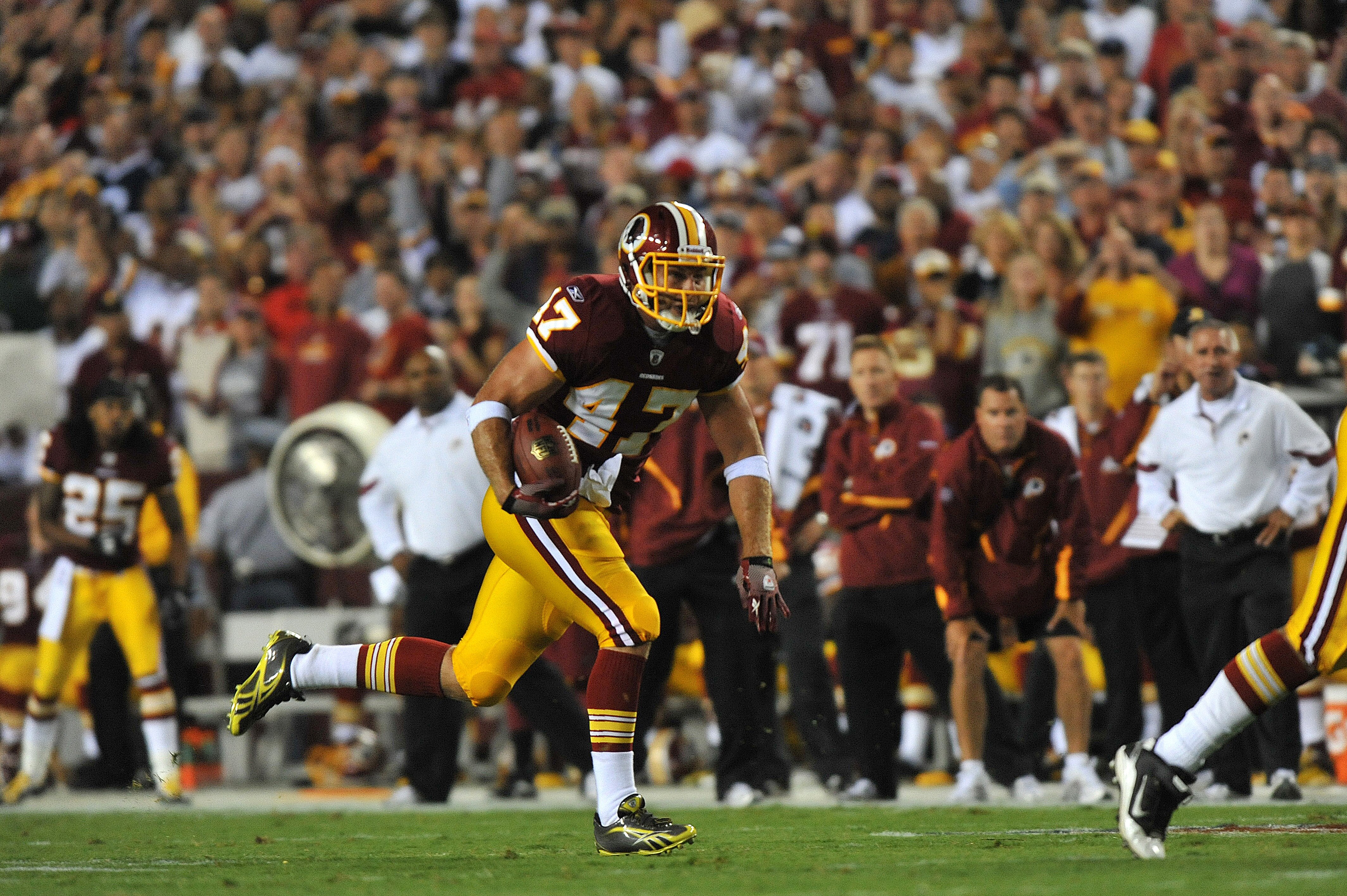 LANDOVER - SEPTEMBER 12:  Chris Cooley #47 of the Washington Redskins runs the ball during the NFL season opener against the Dallas Cowboys at FedExField on September 12, 2010 in Landover, Maryland. The Redskins defeated the Cowboys 13-7. (Photo by Larry