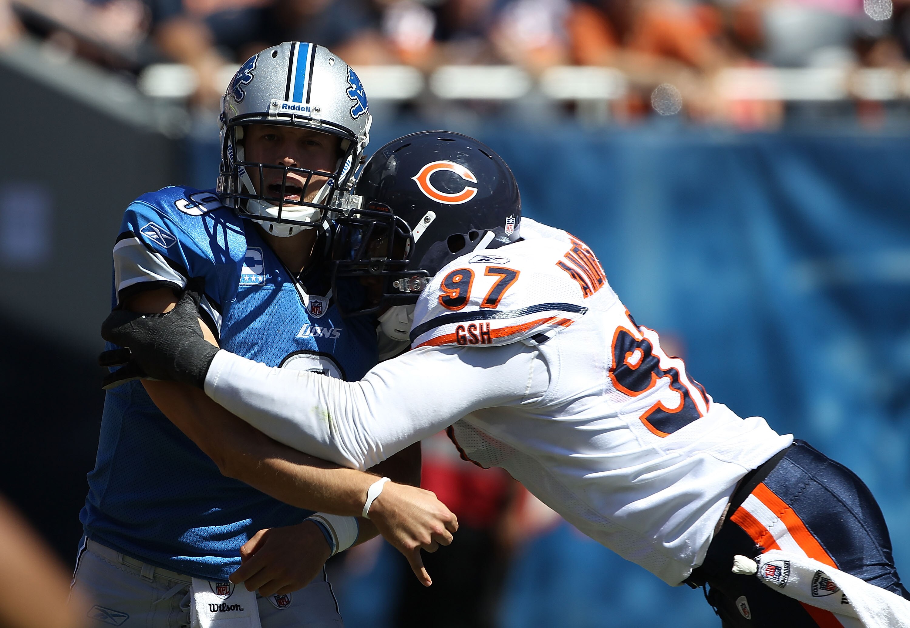 CHICAGO - SEPTEMBER 12: Matthew Stafford #9 of the Detroit Lions is hit after throwing a pass by Mark Anderson #97 of the Chicago Bears during the NFL season opening game at Soldier Field on September 12, 2010 in Chicago, Illinois. (Photo by Jonathan Dani