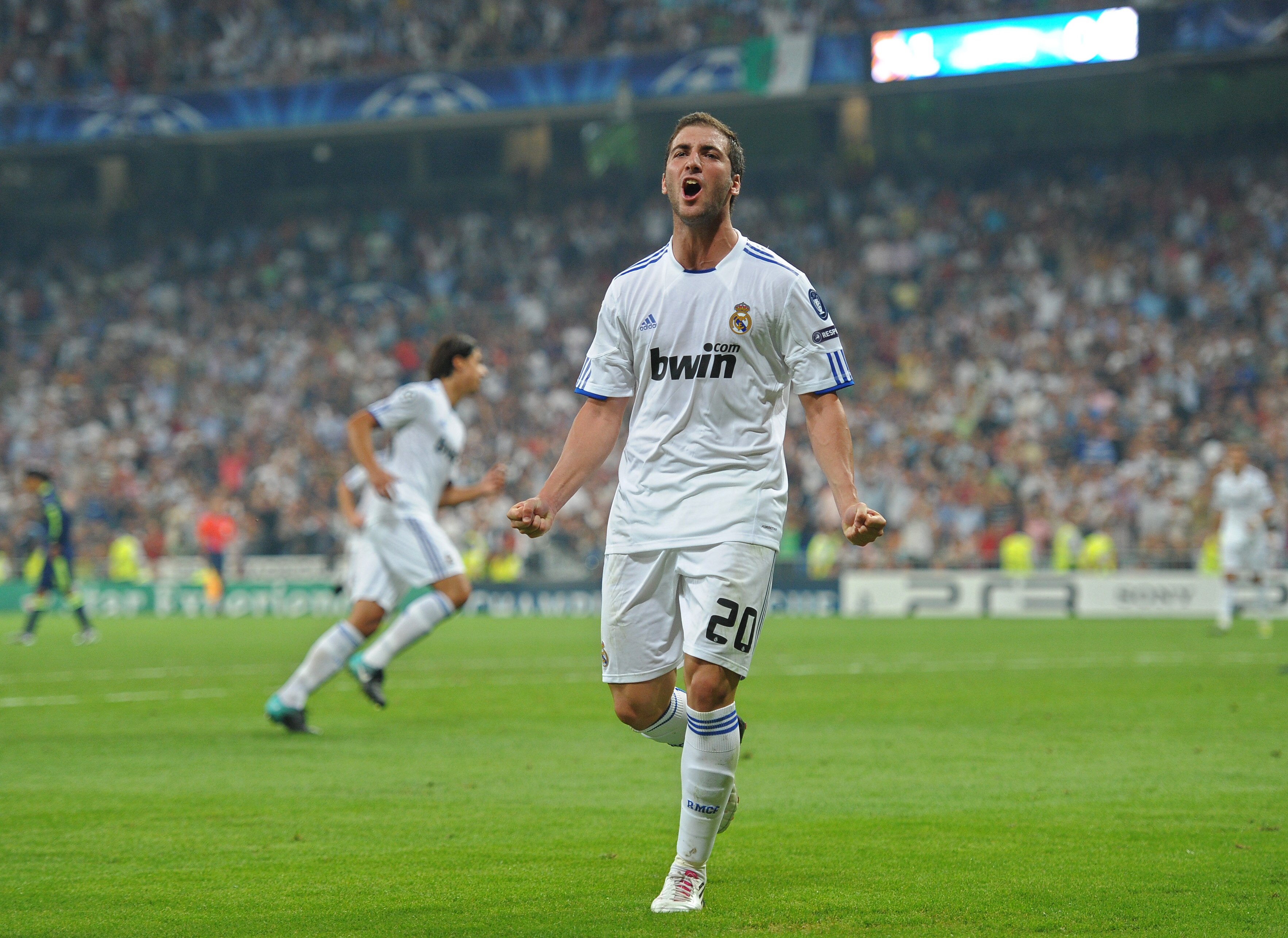 MADRID, SPAIN - SEPTEMBER 15:  Gonzalo Higuain of Real Madrid celebrates scoring his sides second goal during the UEFA Champions League group G match between Real Madrid and Ajax at the Estadio Santiago Bernabeu on September 15, 2010 in Madrid, Spain.  (P