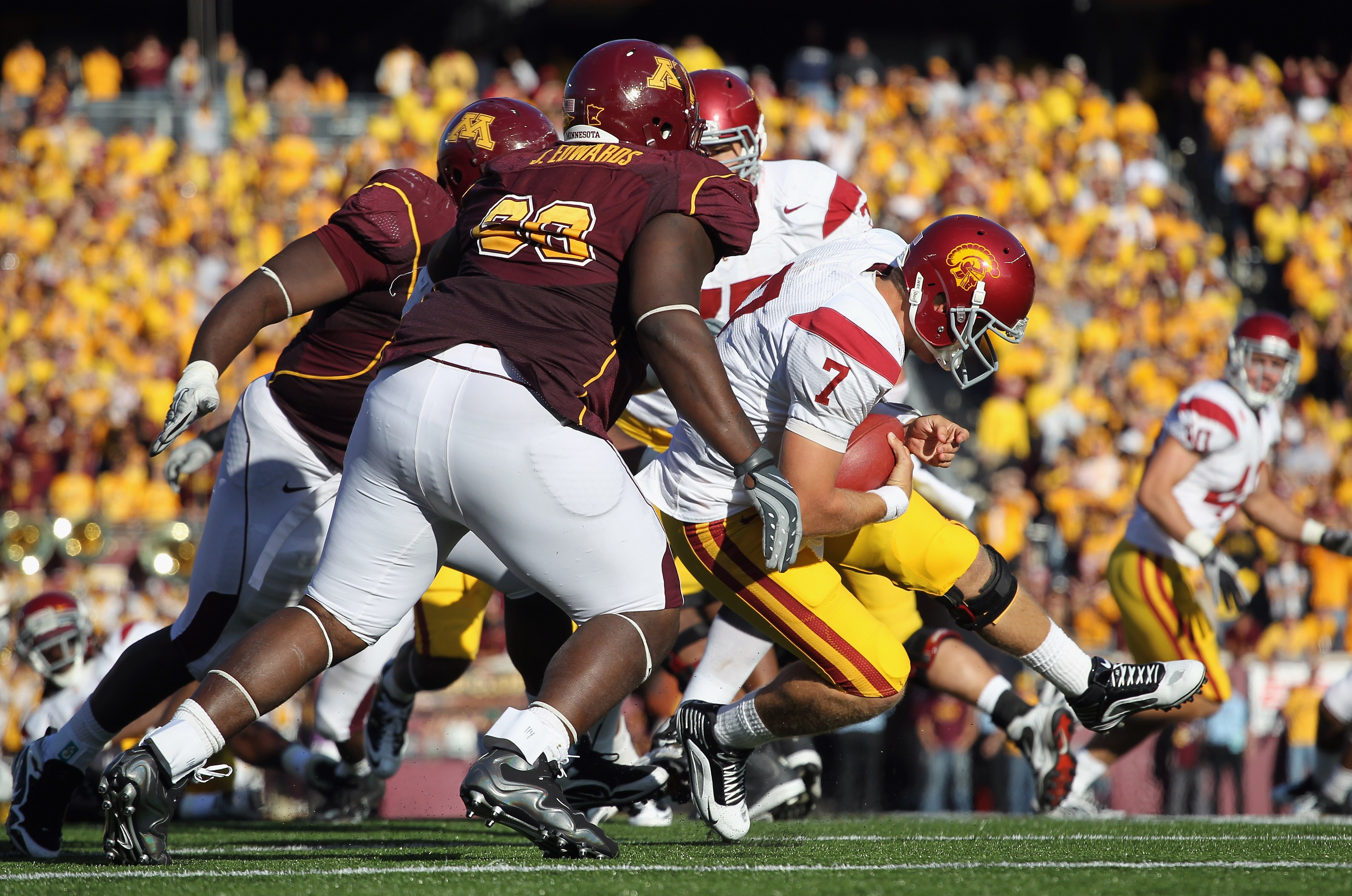MINNEAPOLIS - SEPTEMBER 18:  Quarterback Matt Barkley #7 of the USC Trojans is sacked during the game against the Minnesota Golden Gophers on September 18, 2010 at TCF Bank Stadium in Minneapolis, Minnesota.  (Photo by Jamie Squire/Getty Images)