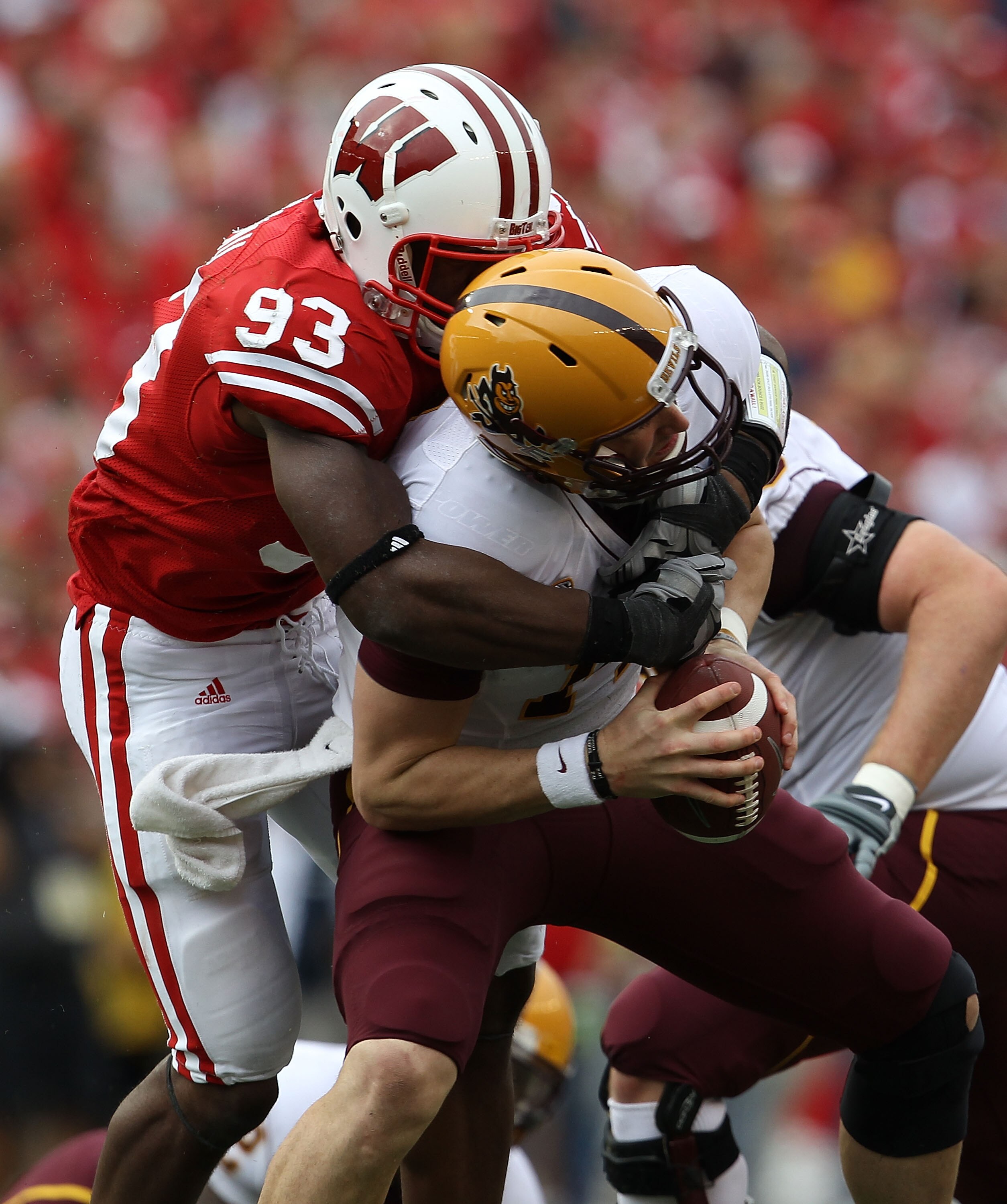 MADISON, WI - SEPTEMBER 18: Louis Nzegwu #93 of the Wisconsin Badgers sacks Steven Threet #14 of the Arizona State Sun Devils at Camp Randall Stadium on September 18, 2010 in Madison, Wisconsin. (Photo by Jonathan Daniel/Getty Images)