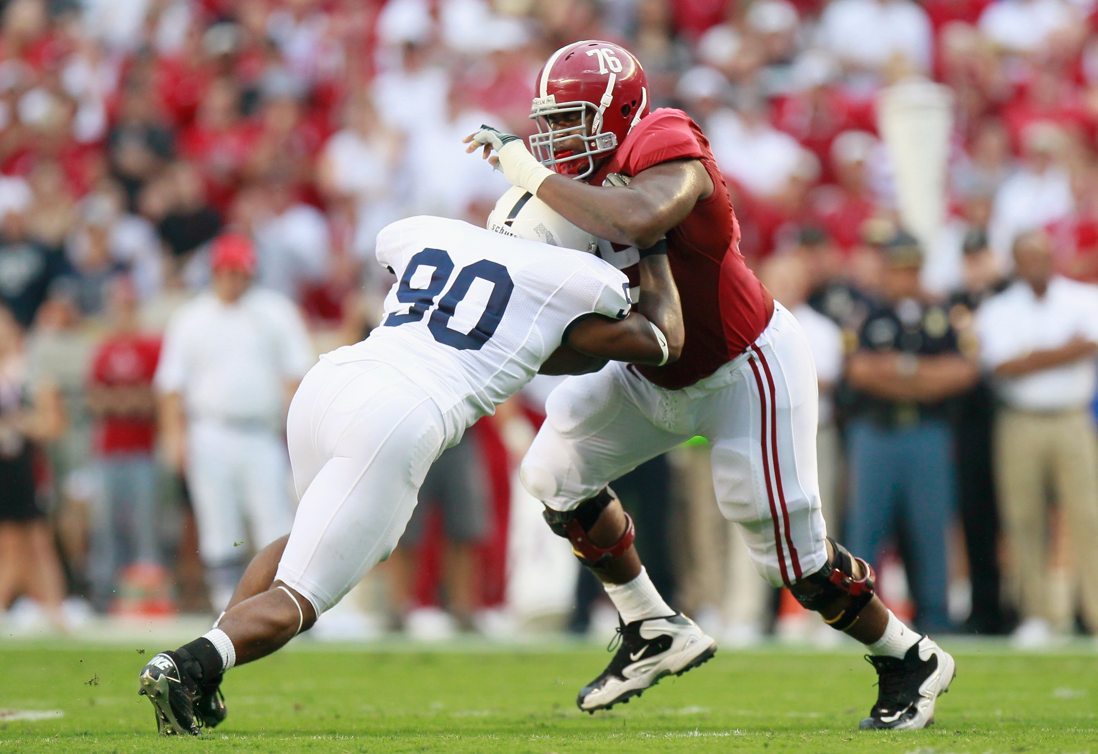 TUSCALOOSA, AL - SEPTEMBER 11:  D.J. Fluker #76 of the Alabama Crimson Tide against Sean Stanley #90 of the Penn State Nittany Lions at Bryant-Denny Stadium on September 11, 2010 in Tuscaloosa, Alabama.  (Photo by Kevin C. Cox/Getty Images)