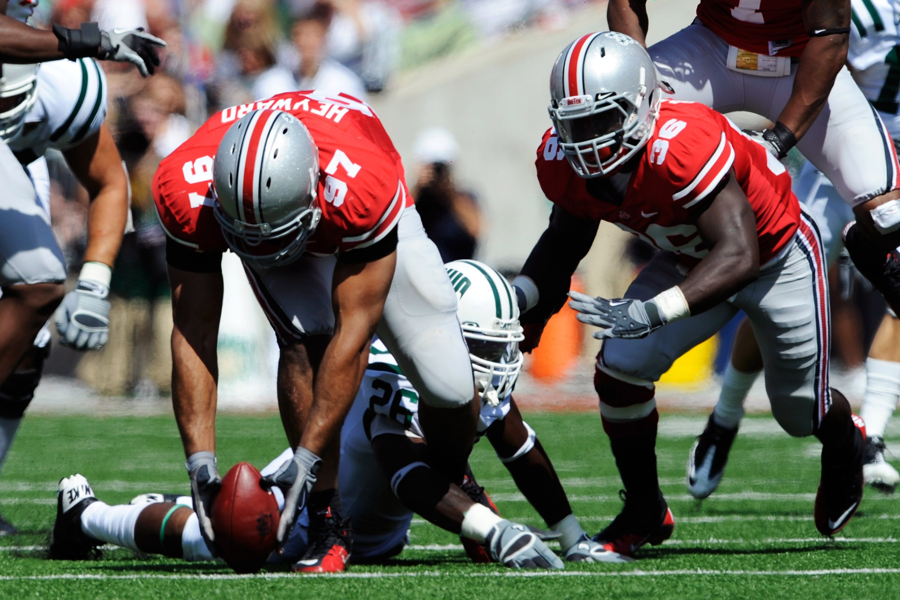 COLUMBUS, OH - SEPTEMBER 18:  Cameron Heyward #97 of the Ohio State Buckeyes picks up a fumble by Vince Davidson #26 of the Ohio Bobcats at Ohio Stadium on September 18, 2010 in Columbus, Ohio.  (Photo by Jamie Sabau/Getty Images)