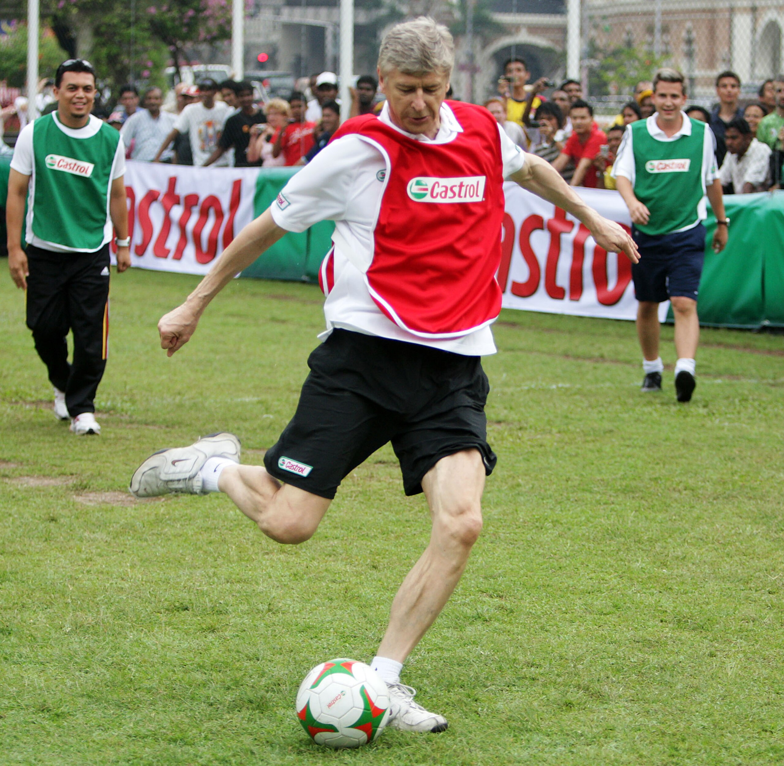 KUALA LUMPUR, MALAYSIA - JUNE 9:   Arsene Wenger meets the fans before taking the Malaysian youth team through the Castrol Challenge at the Dataran Merdeka Square during his tour of Asia with FIFA World Cup sponsor Castrol on June 9, 2008 in Kuala Lumpur,