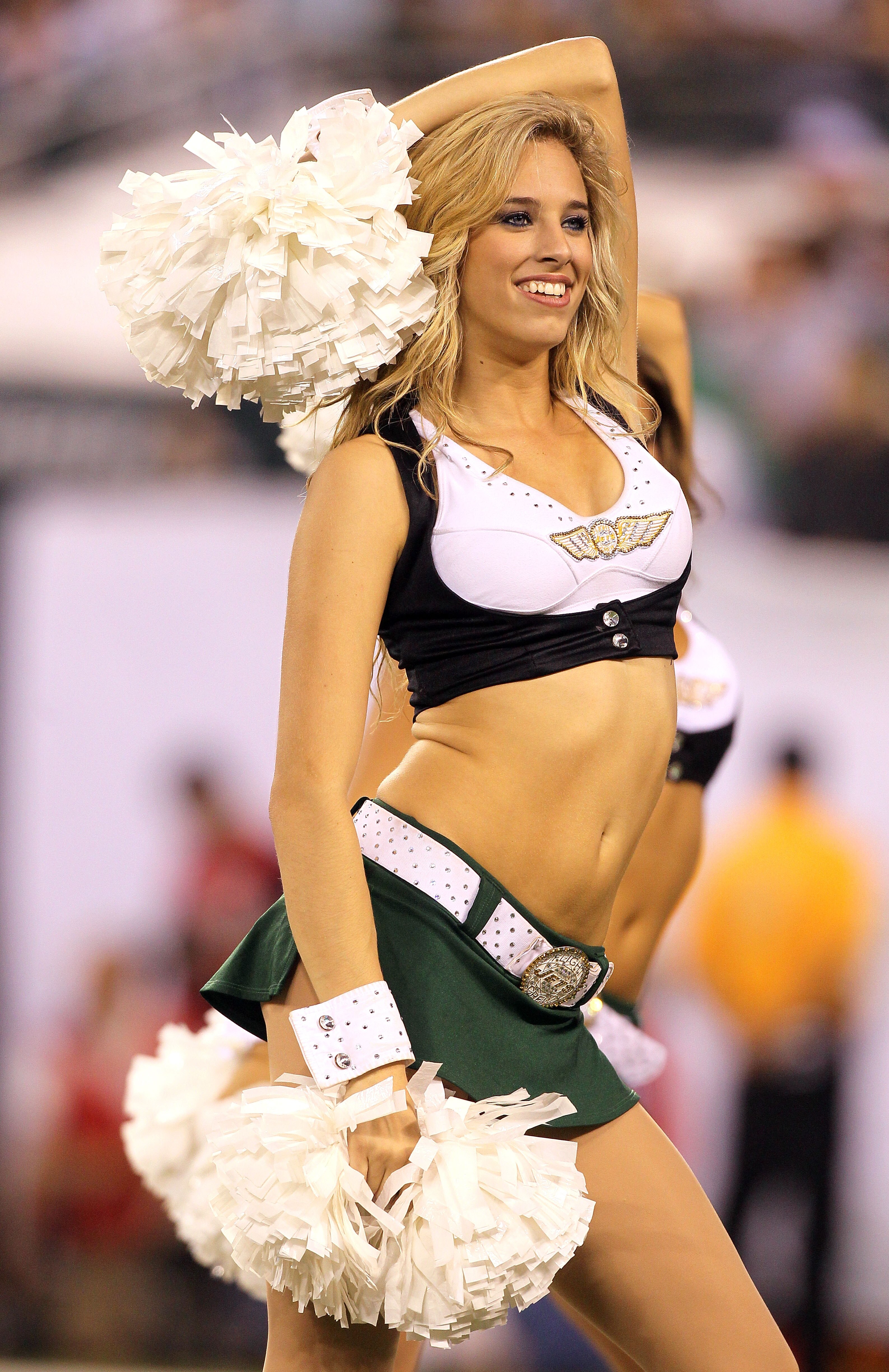 EAST RUTHERFORD, NJ - SEPTEMBER 13:  A cheerleader for the New York Jets dances during a break in their home opener against the Baltimore Ravens at the New Meadowlands Stadium on September 13, 2010 in East Rutherford, New Jersey.  (Photo by Jim McIsaac/Ge