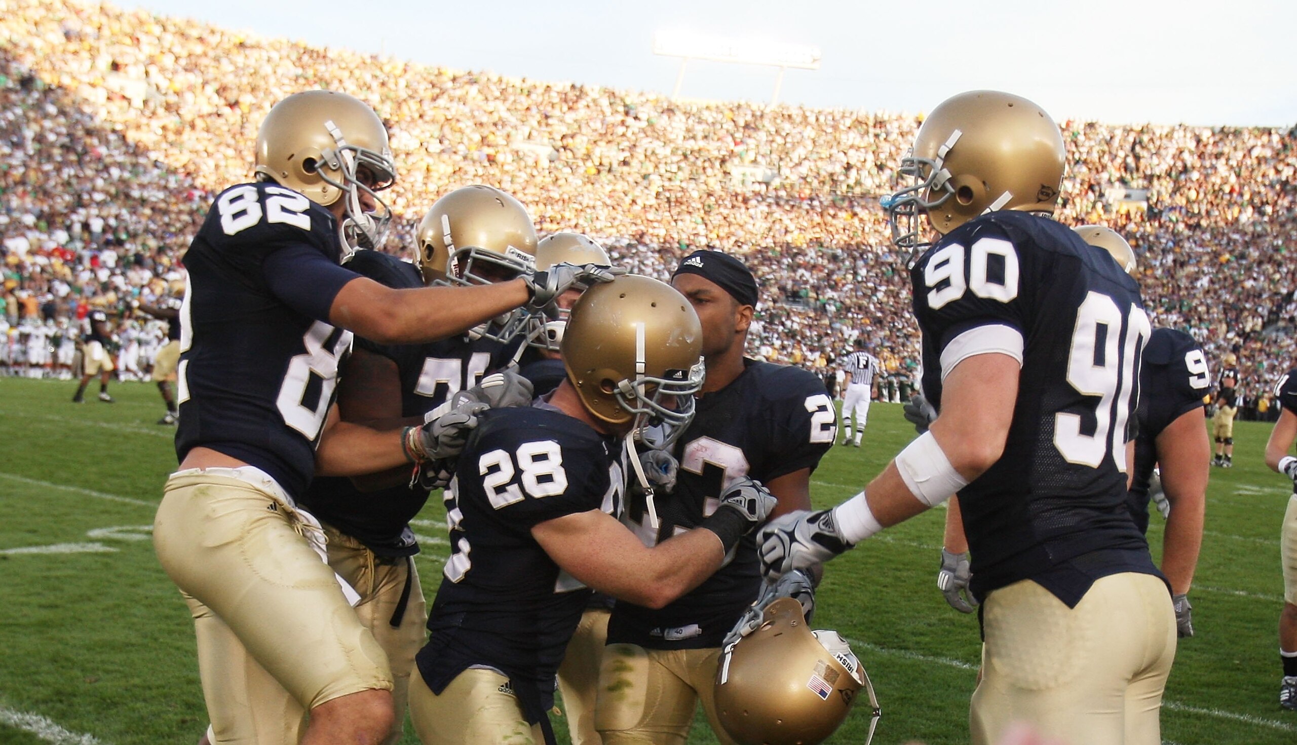 SOUTH BEND, IN - SETPEMBER 19: Kyle McCarthy #28 of the Notre Dame Fighting Irish is greeted by teammates including Robby Paris #82, Golden Tate #23 and John Ryan #90 after he intercepted a pass in the final minute of a game against the Michigan State Spa