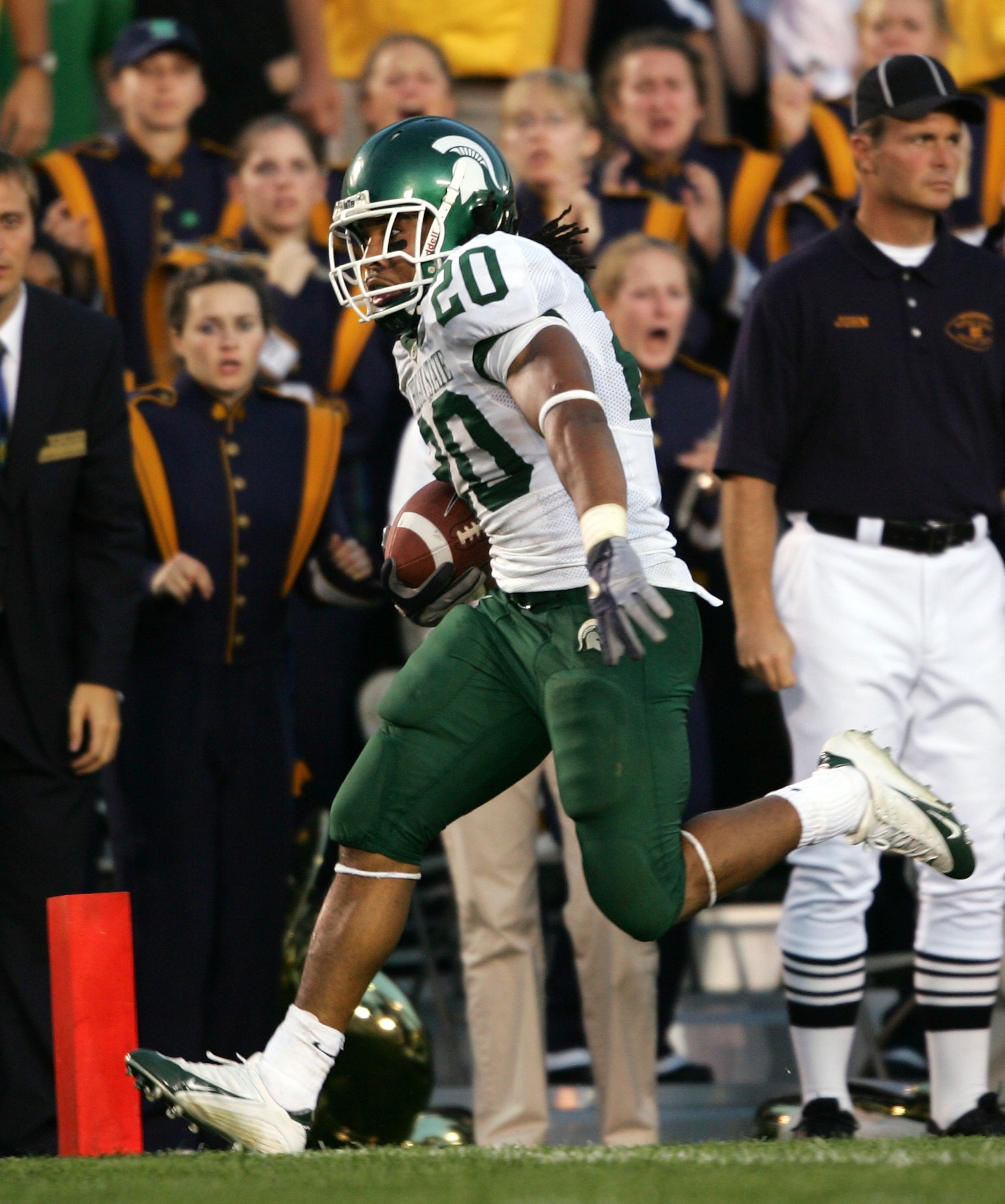SOUTH BEND, IN - SEPTEMBER 17:  Running back Jason Teague #20 of the Michigan State Spartans rushes for a 19-yard touchdown to win the game in overtime against the Notre Dame Fighting Irish on September 17, 2005 at Notre Dame Stadium in South Bend, Indian