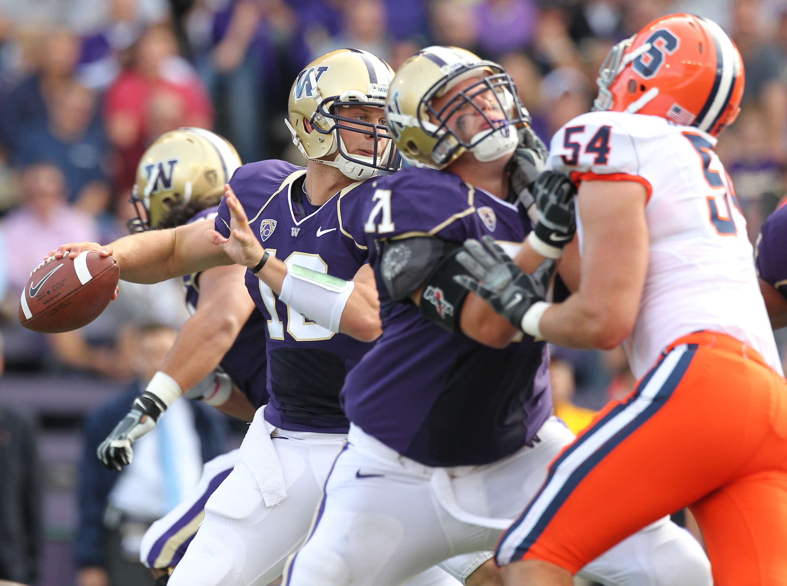 SEATTLE - SEPTEMBER 11:  Quarterback Jake Locker #10 of the Washington Huskies passes against the Syracuse Orange on September 11, 2010 at Husky Stadium in Seattle, Washington. (Photo by Otto Greule Jr/Getty Images)