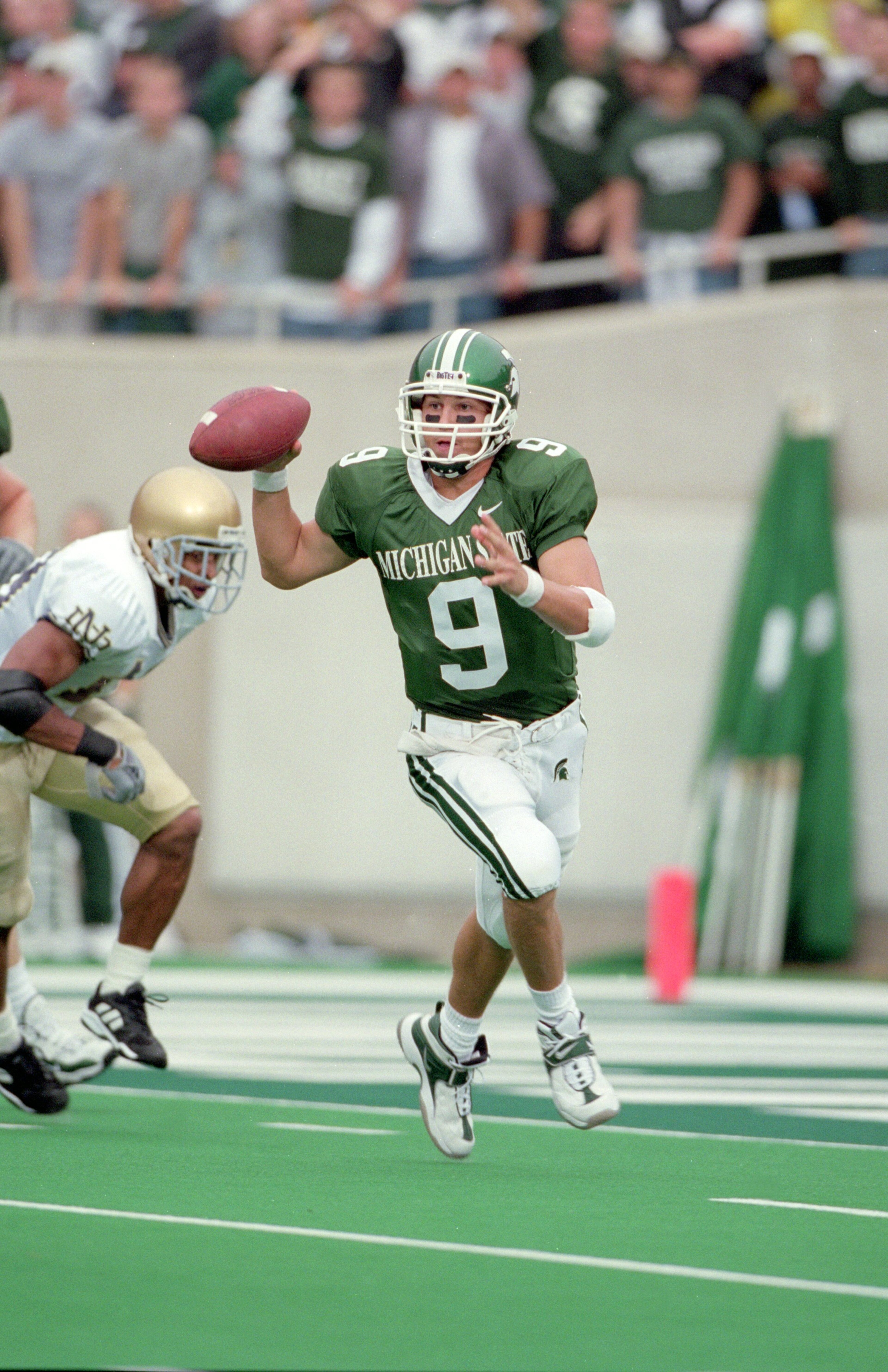 23 Sep 2000:  Jeff Smoker #9 of the Michigan State Spartans moves to pass the ball during the game against the Notre Dame Fighting Irish at the Spartan Stadium in East Lansing, Michigan. The Spartans defeated the Fighting Irish 27-21.Mandatory Credit: Tom