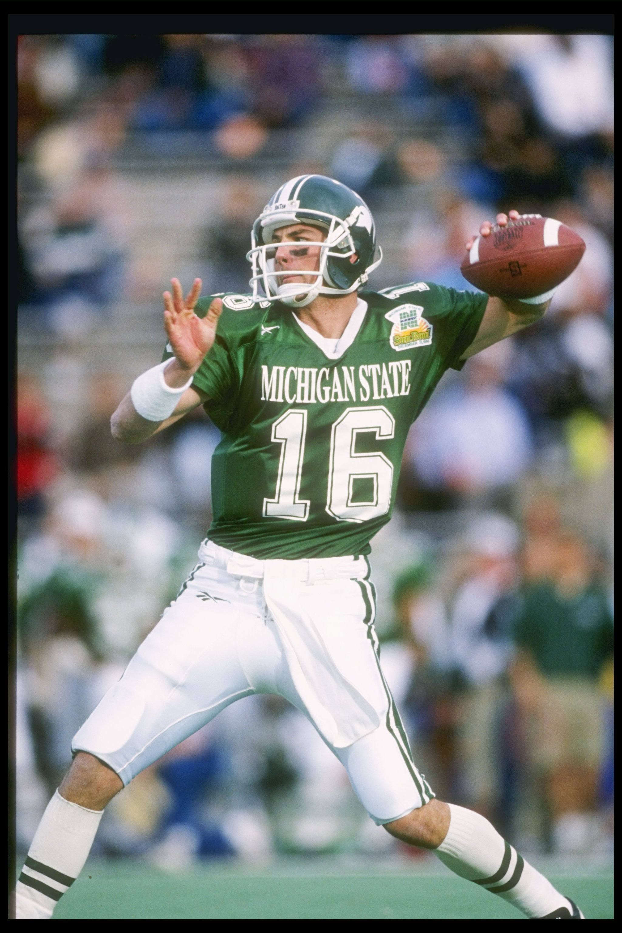 31 Dec 1996:  Quarterback Bill Burke of the Michigan State Spartans drops back to pass during the Norwest Sun Bowl game against the Stanford Cardinals in El Paso, Texas.  Stanford won the game 38-0. Mandatory Credit: Stephen Dunn  /Allsport