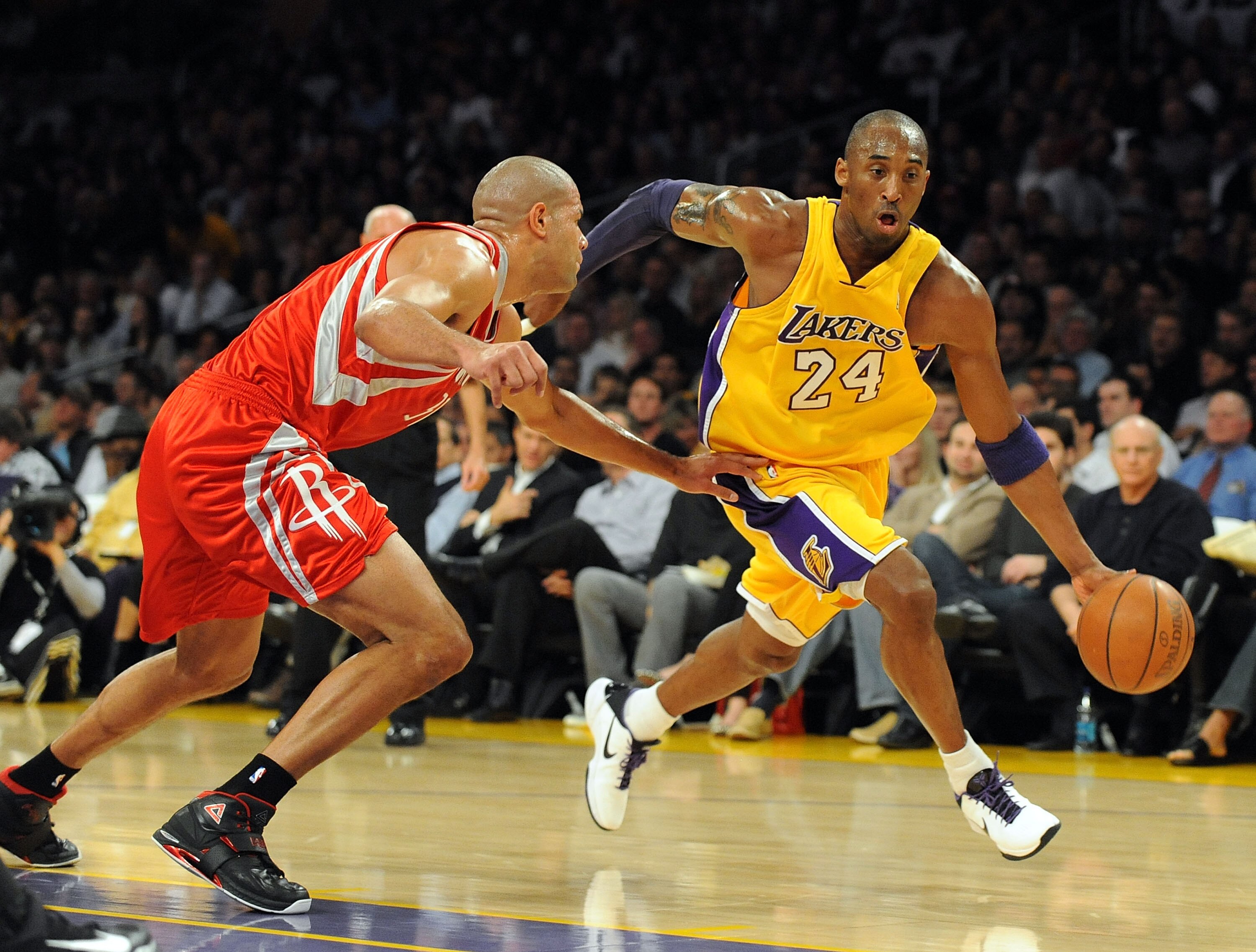 LOS ANGELES, CA - JANUARY 05:  Kobe Bryant #24 of the Los Angeles Lakers dribbles around Shane Battier #31 of the Houston Rockets during the first half at Staples Center on January 5, 2010 in Los Angeles, California.  NOTE TO USER: User expressly acknowle