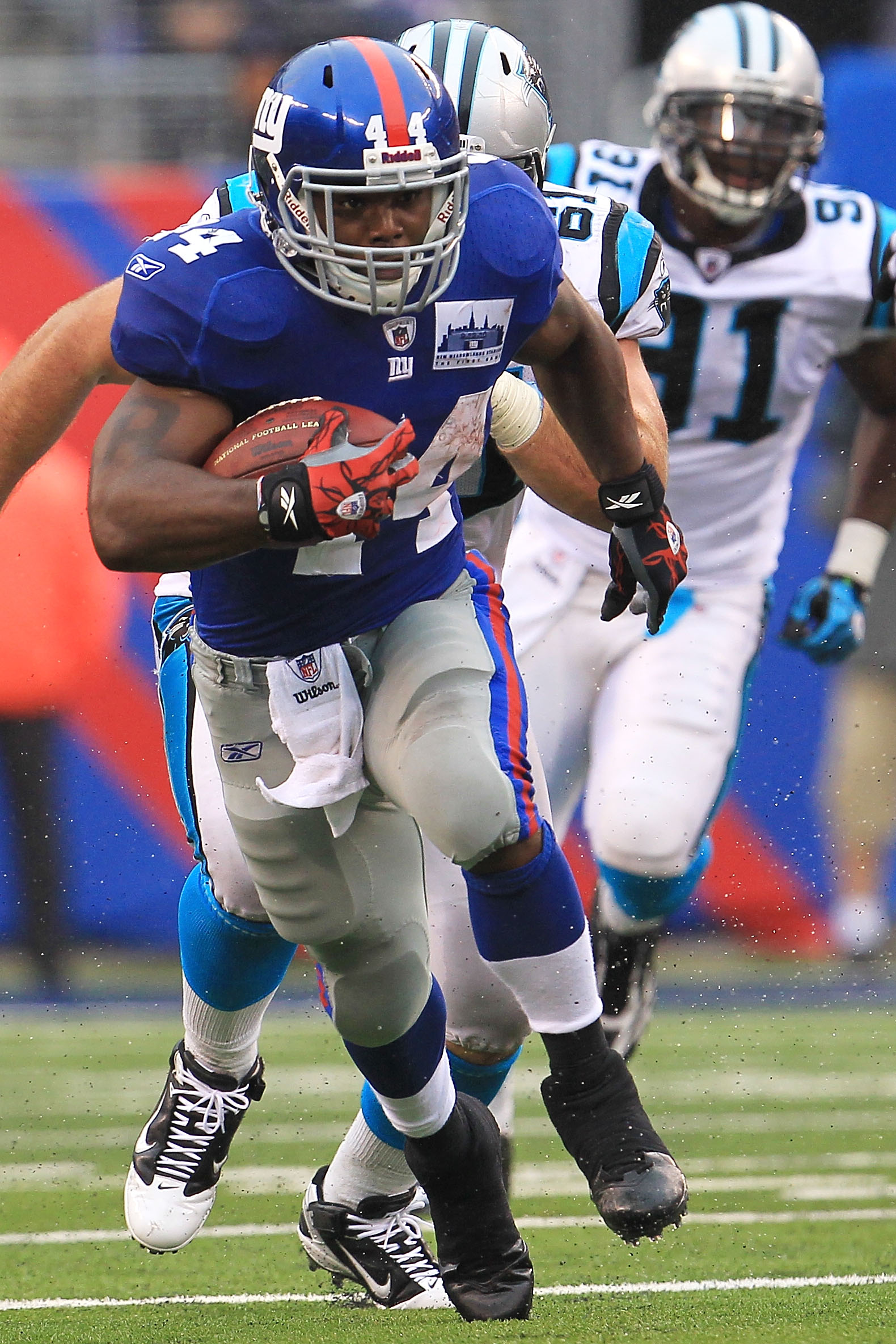 EAST RUTHERFORD, NJ - SEPTEMBER 12: Ahmad Bradshaw #44 of the New York Giants makes a break against the Carolina Panthers during the NFL season opener at New Meadowlands Stadium on September 12, 2010 in East Rutherford, New Jersey. (Photo by Chris McGra EAST RUTHERFORD, NJ - SEPTEMBER 12: Ahmad Bradshaw #44 of the New York Giants makes a break against the Carolina Panthers during the NFL season opener at New Meadowlands Stadium on September 12, 2010 in East Rutherford, New Jersey. (Photo by Chris McGra