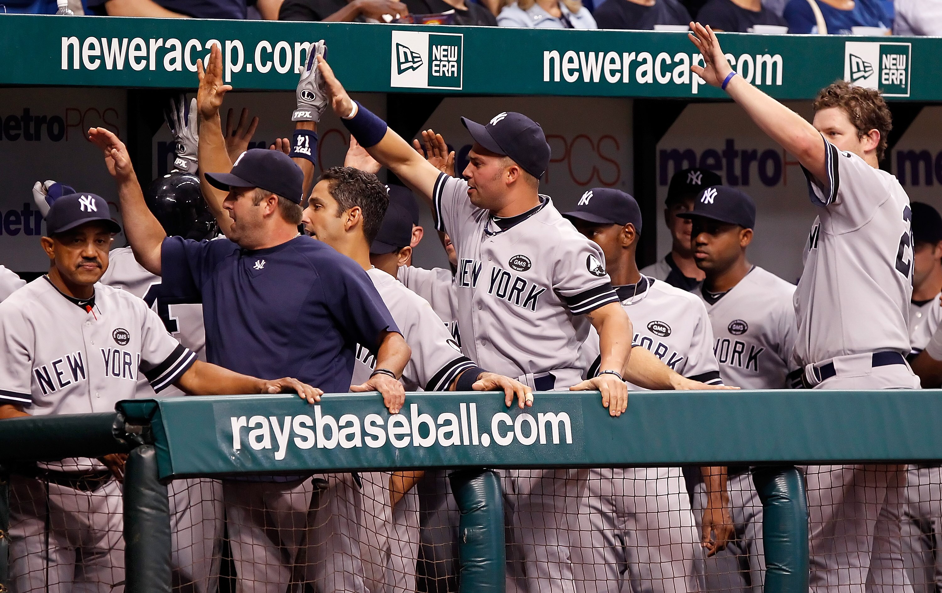 ST. PETERSBURG, FL - SEPTEMBER 15:  The New York Yankees celebrate Curtis Granderson's seventh inning home run against the Tampa Bay Rays during the game at Tropicana Field on September 15, 2010 in St. Petersburg, Florida.  (Photo by J. Meric/Getty Images