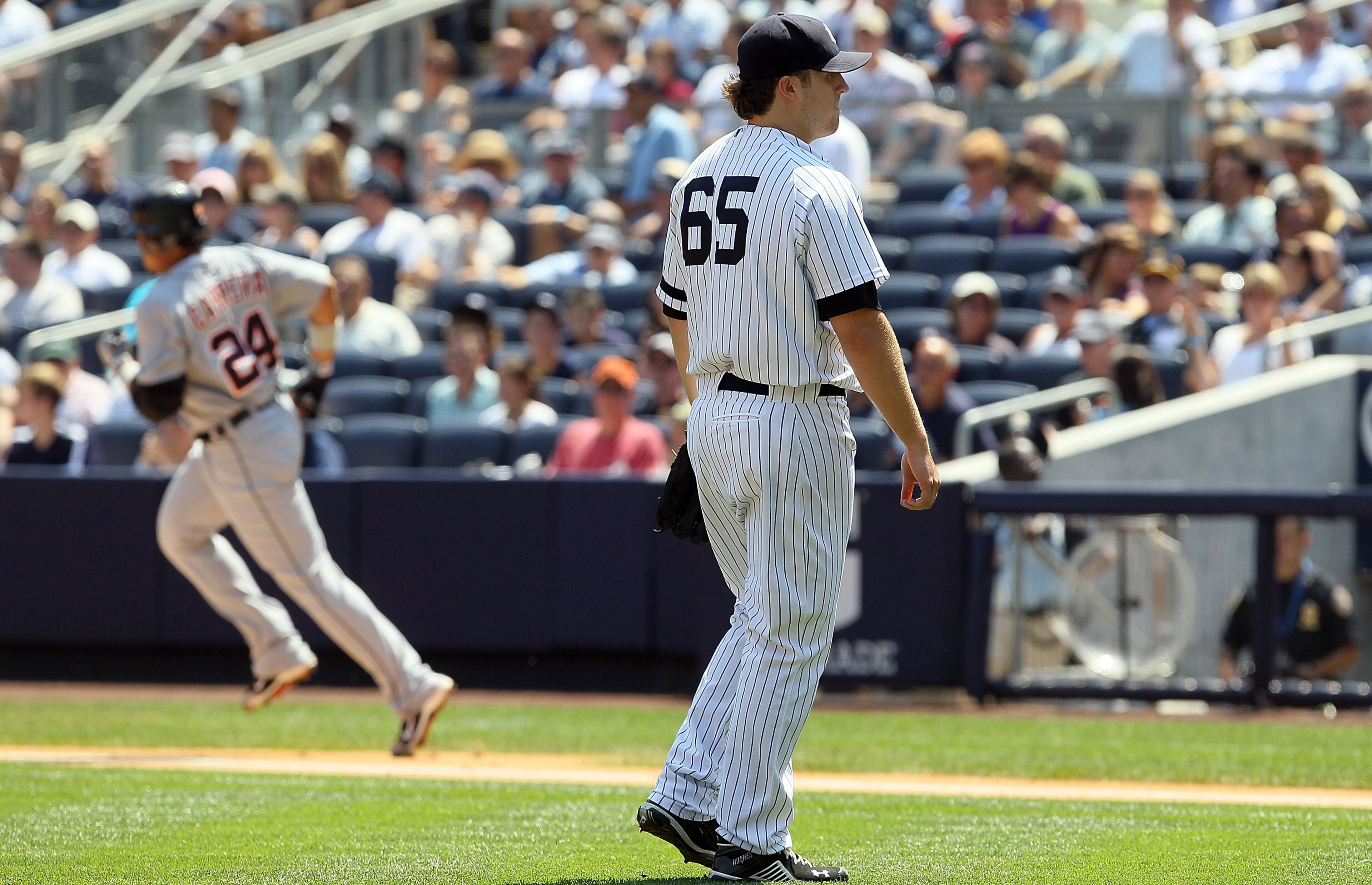 NEW YORK - AUGUST 19: Phil Hughes #65 of the New York Yankees looks on after surrendering a first inning two run home run against Miguel Cabrera #24 of the Detroit Tigers on August 19, 2010 at Yankee Stadium in the Bronx borough of New York City. (Photo NEW YORK - AUGUST 19: Phil Hughes #65 of the New York Yankees looks on after surrendering a first inning two run home run against Miguel Cabrera #24 of the Detroit Tigers on August 19, 2010 at Yankee Stadium in the Bronx borough of New York City. (Photo
