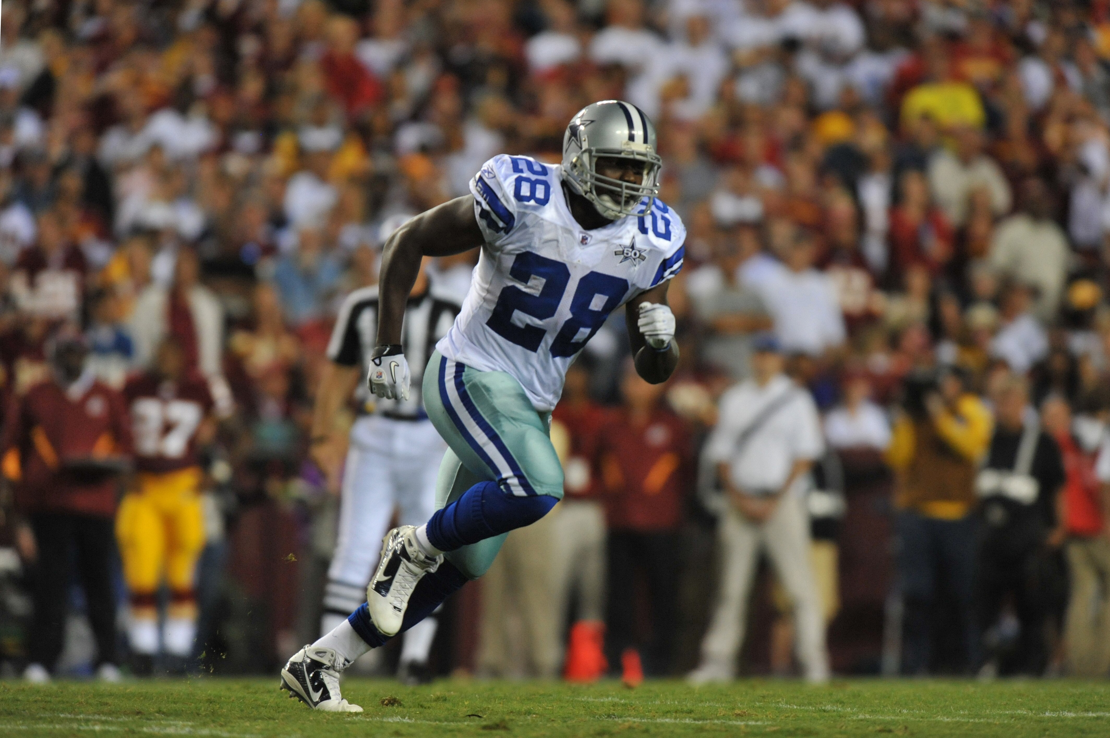 LANDOVER - SEPTEMBER 12:  Felix Jones #28 of the Dallas Cowboys runs downfield during the NFL season opener against the Washington Redskins at FedExField on September 12, 2010 in Landover, Maryland. The Redskins defeated the Cowboys 13-7. (Photo by Larry