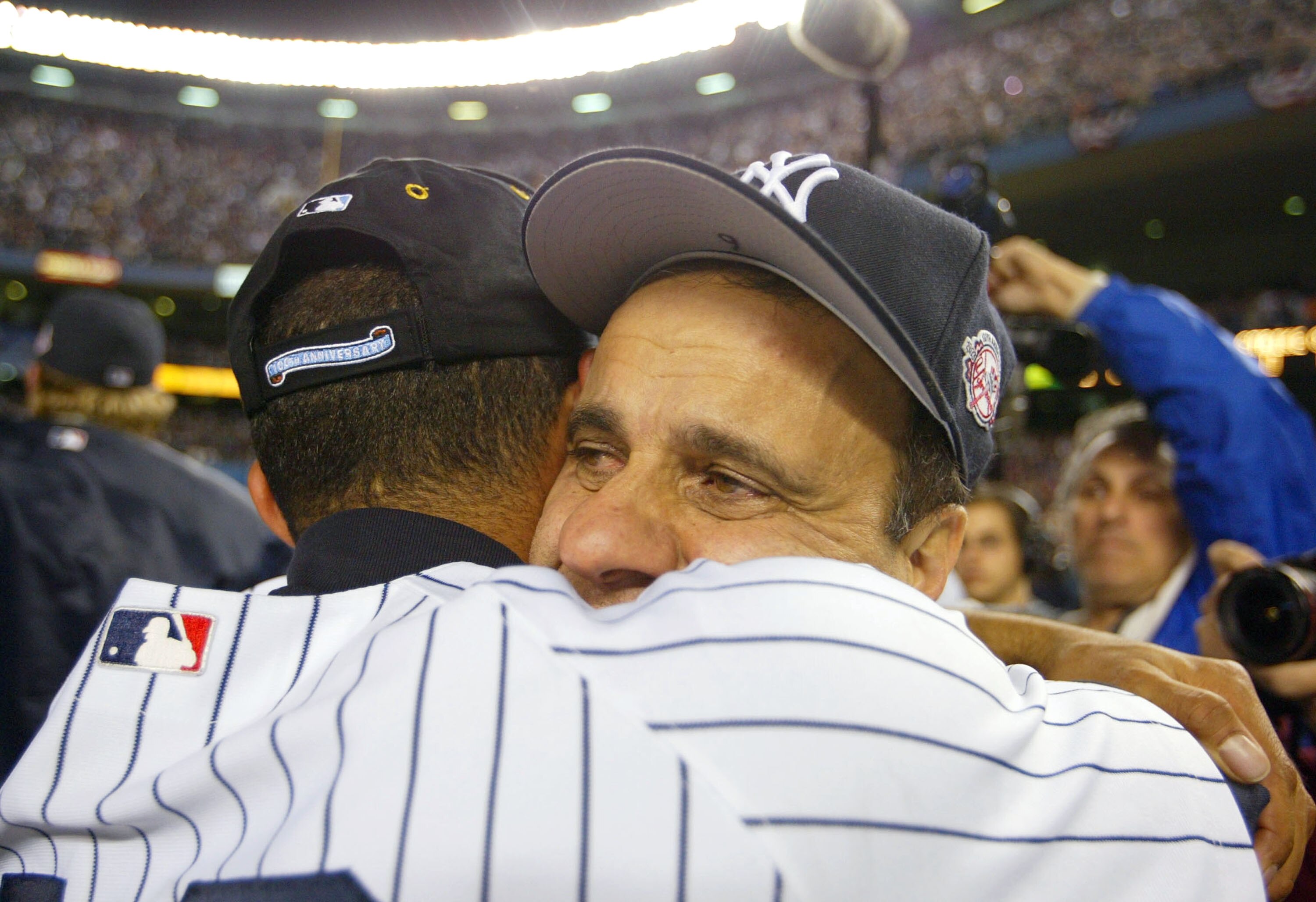 BRONX, NY - OCTOBER 16:  Manager Joe Torre hugs Mariano Rivera #42 of the New York Yankees after defeating the Boston Red Sox 6-5 in game 7 of the American League Championship Series on October 16, 2003 at Yankee Stadium in the Bronx, New York.  The Yanke