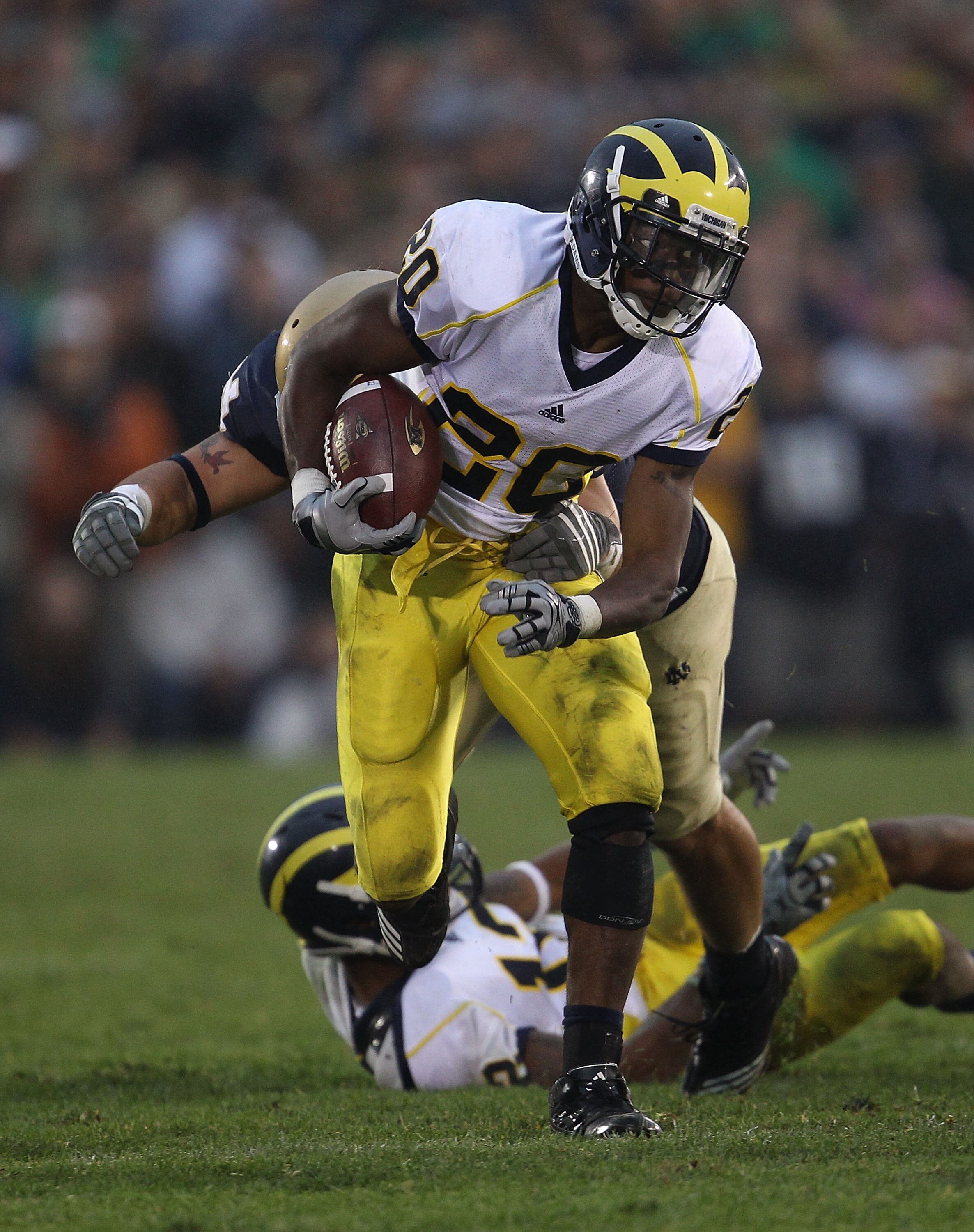 SOUTH BEND, IN - SEPTEMBER 11: Michael Shaw #20 of the Michigan Wolverines runs for yardage against the Notre Dame Fighting Irish at Notre Dame Stadium on September 11, 2010 in South Bend, Indiana. Michigan defeated Notre Dame 28-24. (Photo by Jonathan Da
