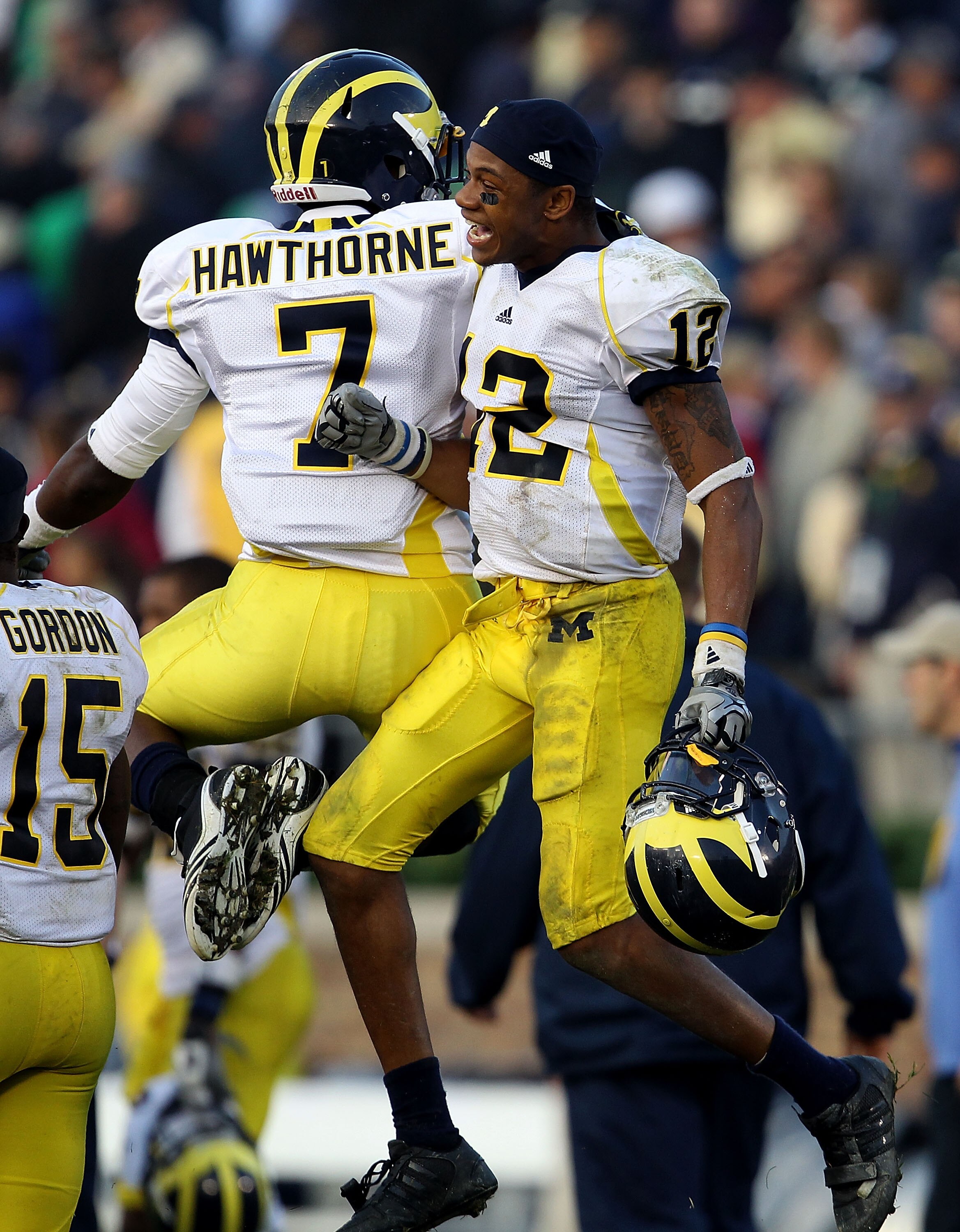 SOUTH BEND, IN - SEPTEMBER 11: Roy Roundtree #12 and Brandin Hawthorne #7 of the Michigan Wolverines celebrate a win over the Notre Dame Fighting Irish at Notre Dame Stadium on September 11, 2010 in South Bend, Indiana. Michigan defeated Notre Dame 28-24.
