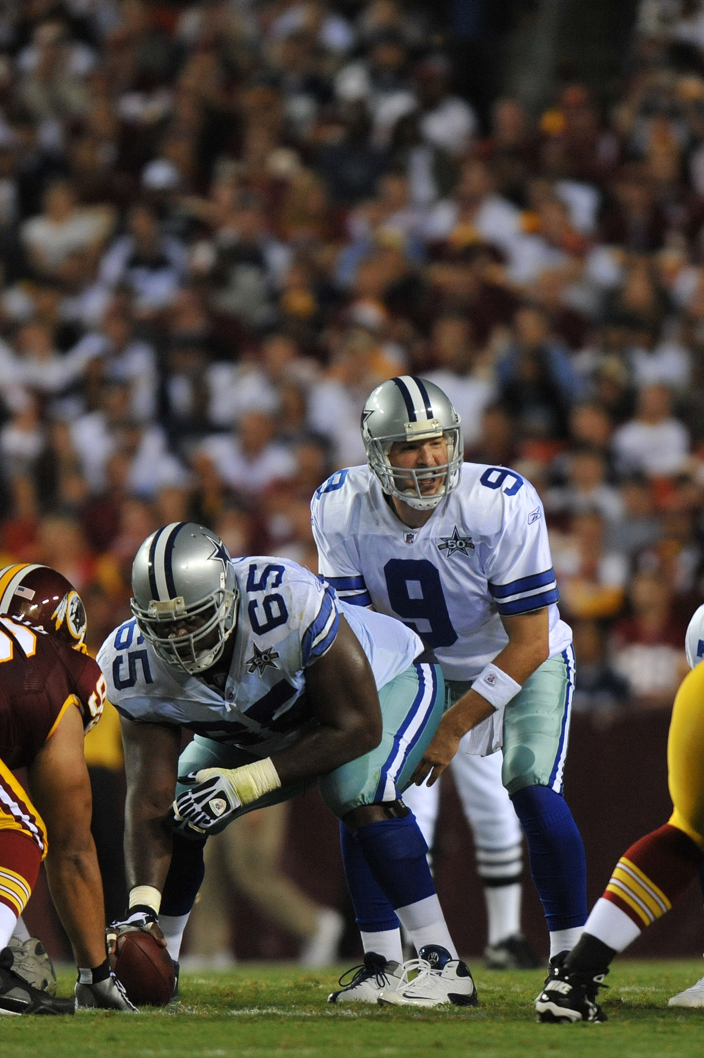 LANDOVER - SEPTEMBER 12:  Tony Romo #9 of the Dallas Cowboys takes the snap during the NFL season opener against the Washington Redskins at FedExField on September 12, 2010 in Landover, Maryland. The Redskins defeated the Cowboys 13-7. (Photo by Larry Fre