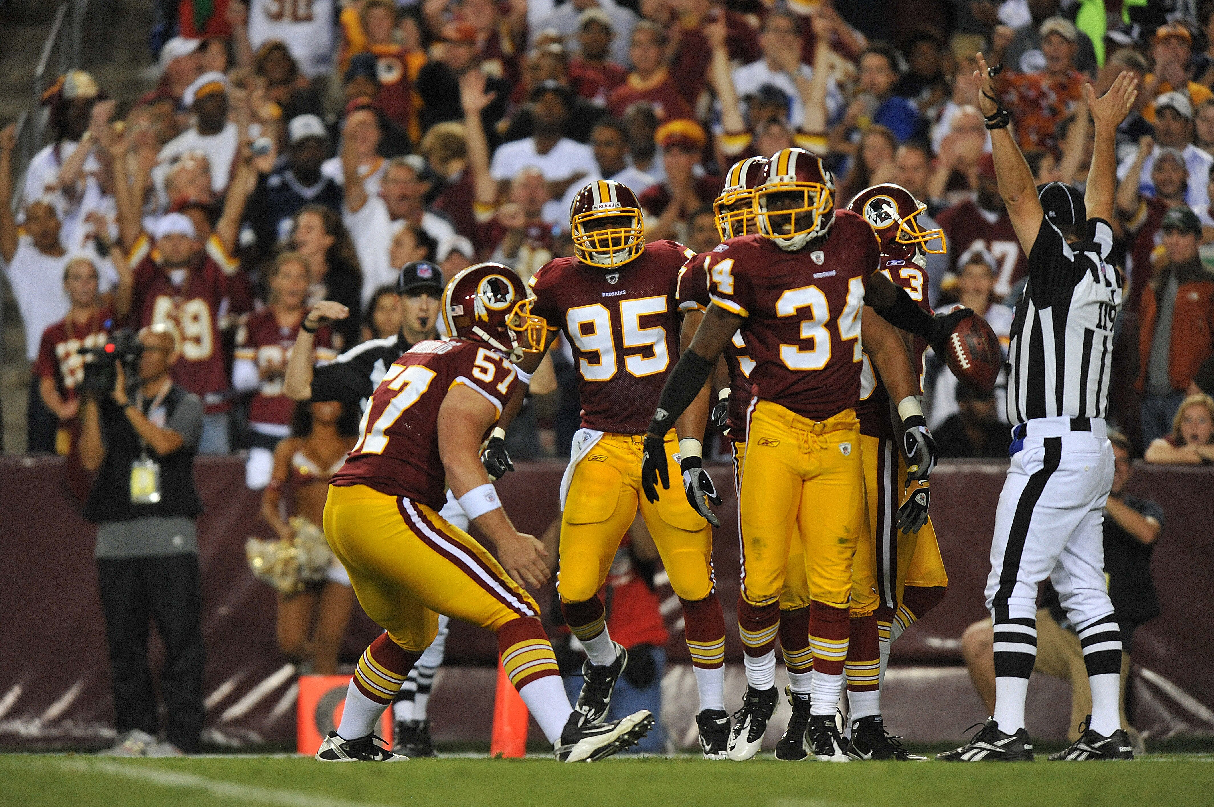 LANDOVER - SEPTEMBER 12:  Byron Westbrook #34 of the Washington Redskins celebrates downing the ball at the one yard line during the NFL season opener against the Dallas Cowboys at FedExField on September 12, 2010 in Landover, Maryland. The Redskins defea