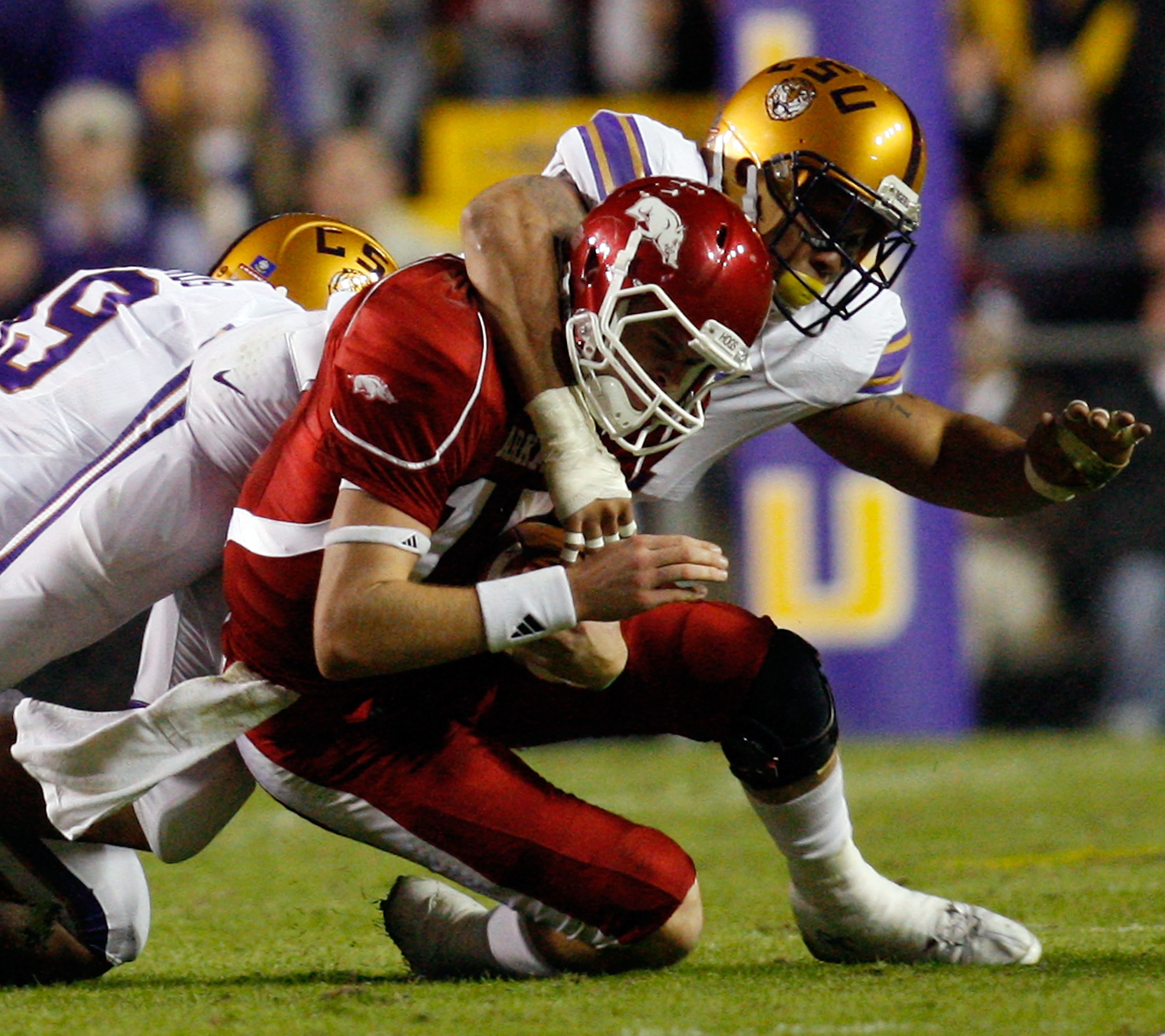 BATON ROUGE, LA - NOVEMBER 28:  Quarterback Ryan Mallett #15 of the Arkansa Razorbacks is tackled by Rahim Alem #84 of the Louisiana State University Tigers at Tiger Stadium on November 28, 2009 in Baton Rouge, Louisiana.  (Photo by Chris Graythen/Getty I