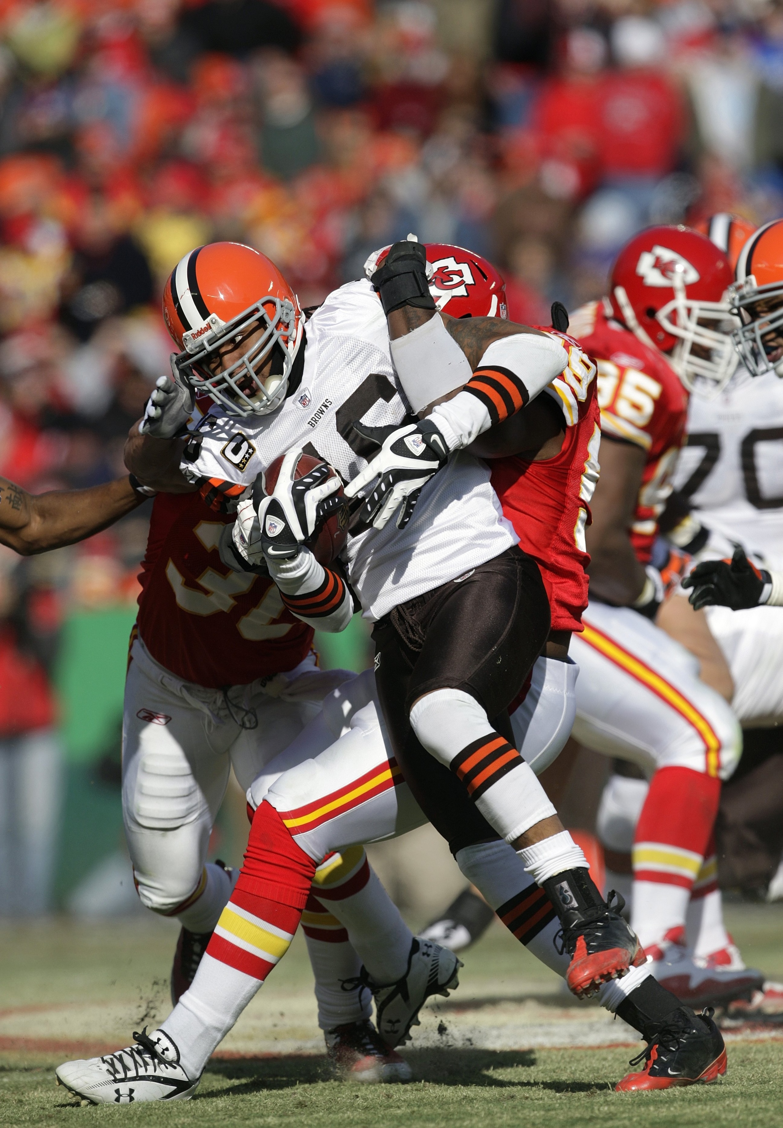 KANSAS CITY, MO - DECEMBER 20:  Joshua Cribbs #16 of the Cleveland Browns struggles for extra yardage during their NFL game against the Kansas City Chiefs on December 20, 2009 at Arrowhead Stadium in Kansas City, Missouri. The Browns defeated the Chiefs 4