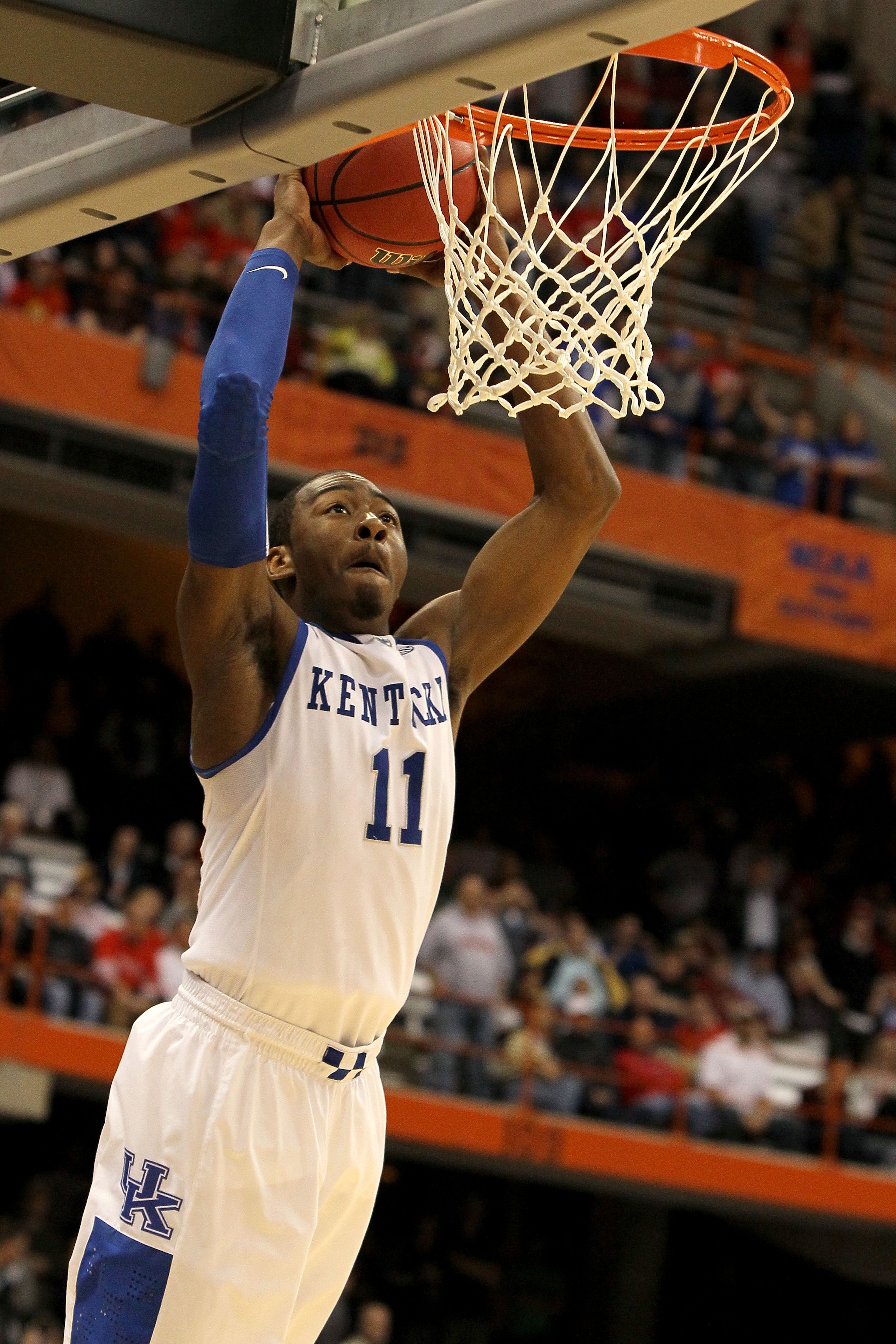 SYRACUSE, NY - MARCH 25:  John Wall #11 of the Kentucky Wildcats dunks in the second half against the Cornell Big Red during the east regional semifinal of the 2010 NCAA men's basketball tournament at the Carrier Dome on March 25, 2010 in Syracuse, New Yo