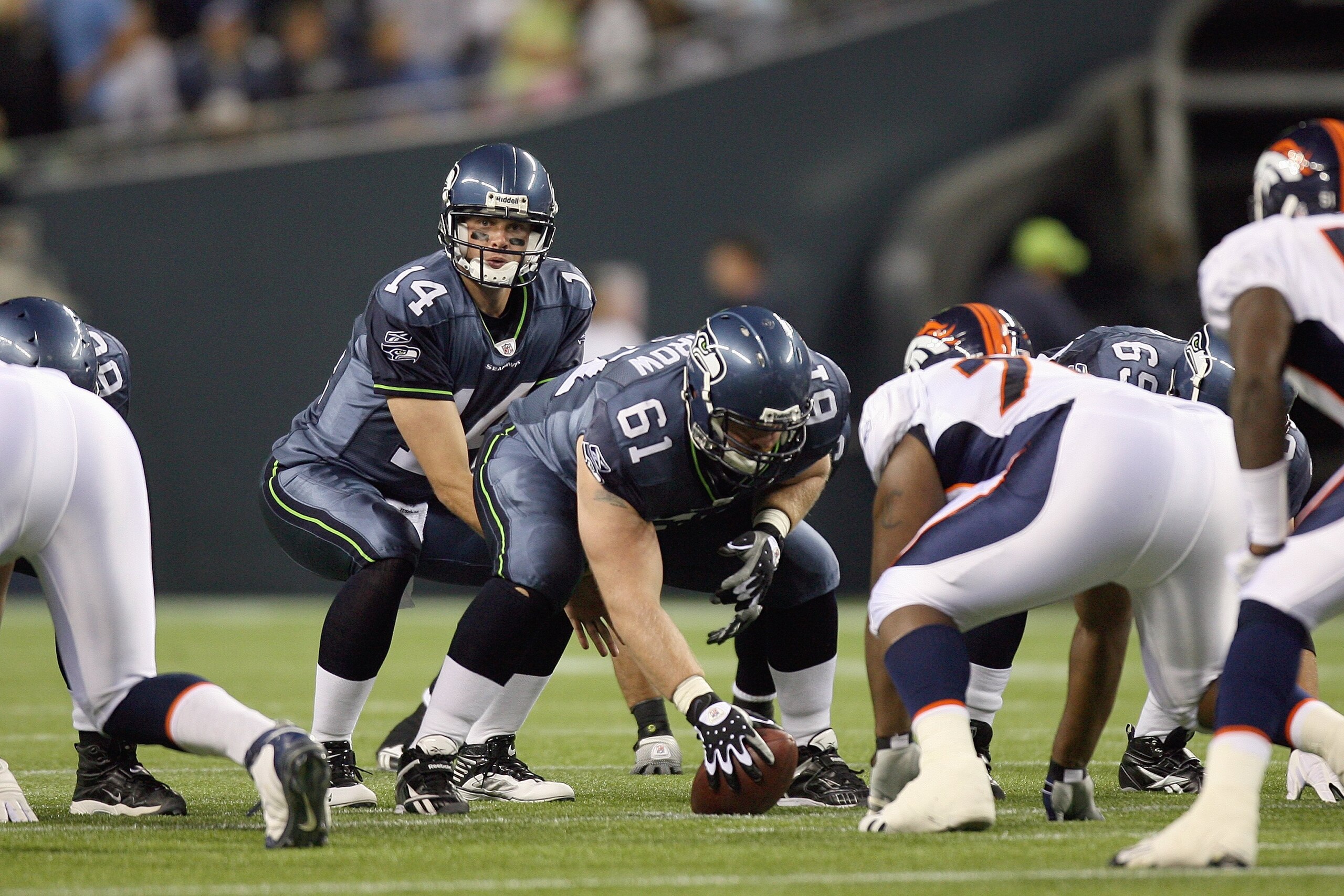 SEATTLE - AUGUST 22:  Quarterback Mike Teel #14 of the Seattle Seahawks calls the play at the line of scrimmage during the game against the Denver Broncos on August 22, 2009 at Qwest Field in Seattle, Washington. (Photo by Otto Greule Jr/Getty Images)