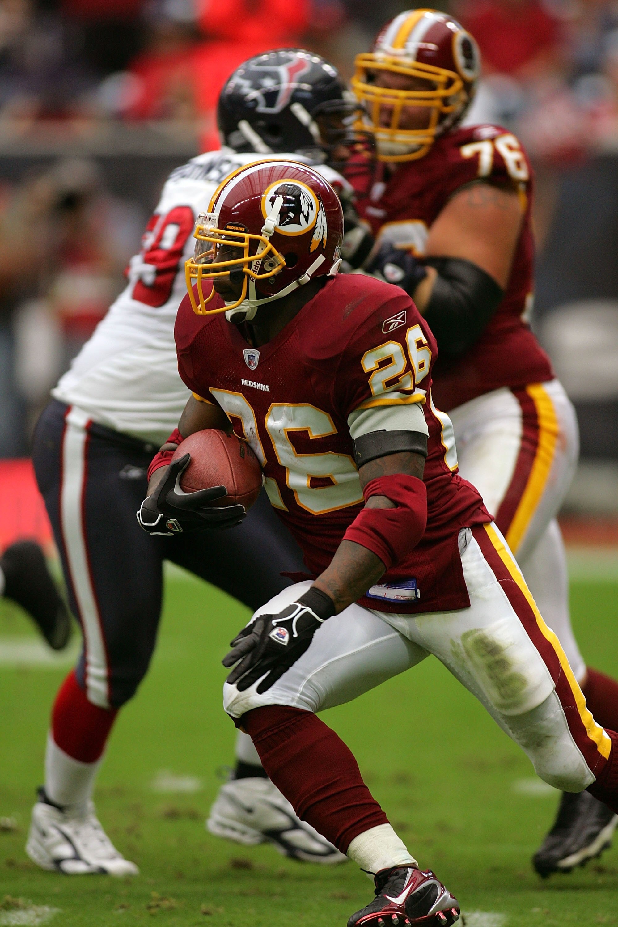 HOUSTON - SEPTEMBER 24:  Running back Clinton Portis #26 of the Washington Redskins runs against the Houston Texans on September 24, 2006 at Reliant Stadium in Houston, Texas. The Redskins defeated the Texans 31-15.  (Photo by Ronald Martinez/Getty Images
