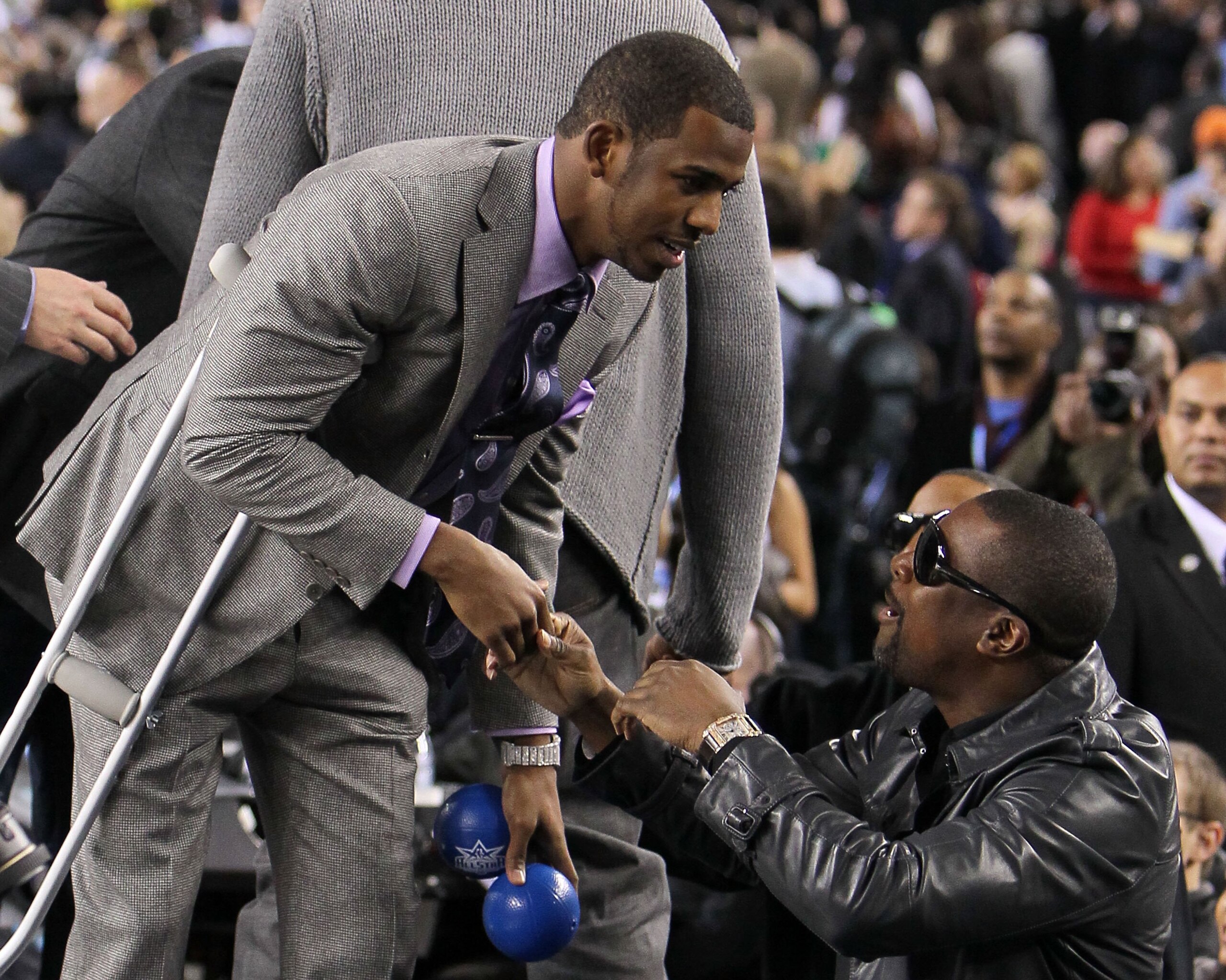 ARLINGTON, TX - FEBRUARY 14:  Chris Paul #3 of the Western Conference shakes hands with actor Chris Tucker during the NBA All-Star Game, part of 2010 NBA All-Star Weekend at Cowboys Stadium on February 14, 2010 in Arlington, Texas. The Eastern Conference 