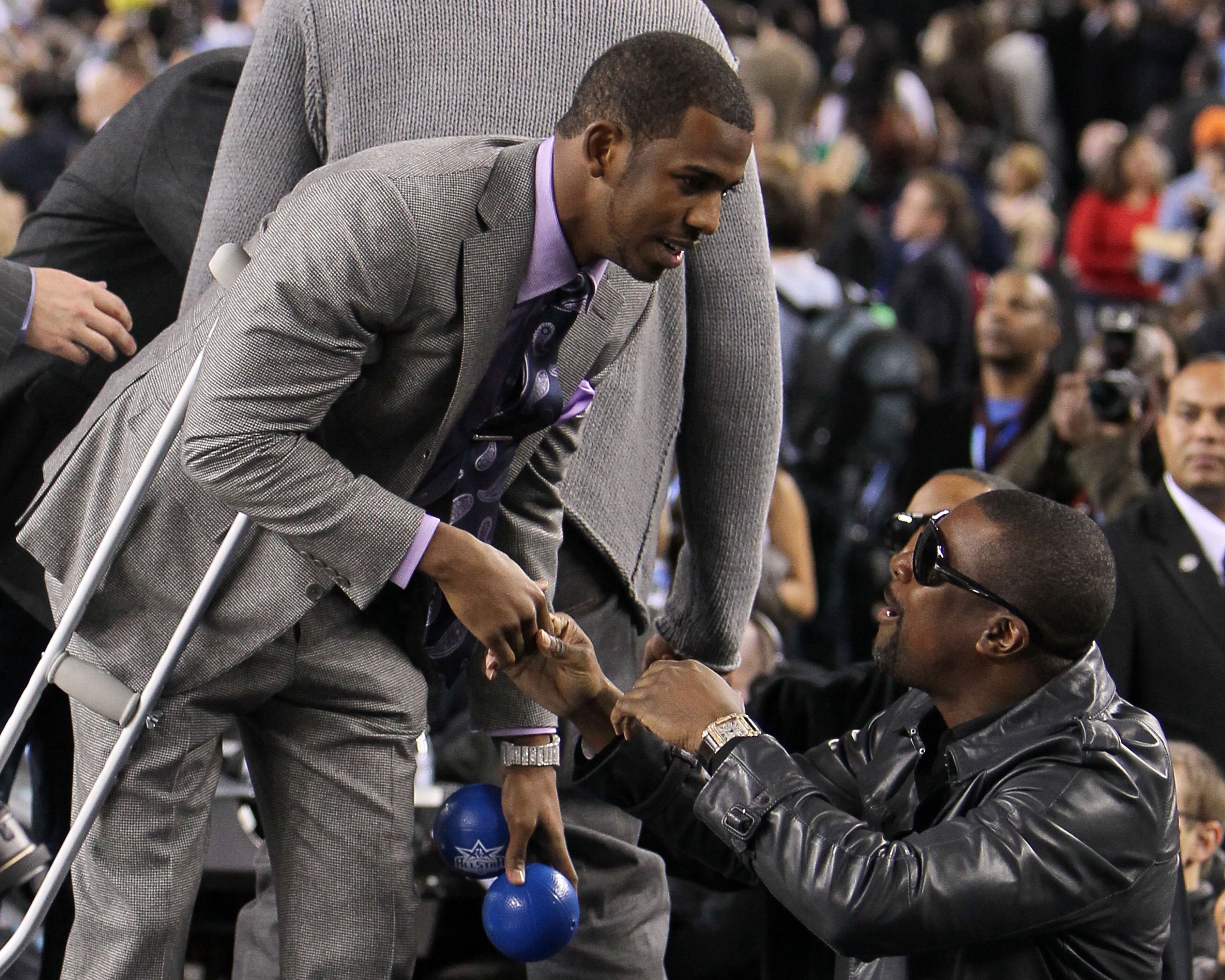 ARLINGTON, TX - FEBRUARY 14:  Chris Paul #3 of the Western Conference shakes hands with actor Chris Tucker during the NBA All-Star Game, part of 2010 NBA All-Star Weekend at Cowboys Stadium on February 14, 2010 in Arlington, Texas. The Eastern Conference 