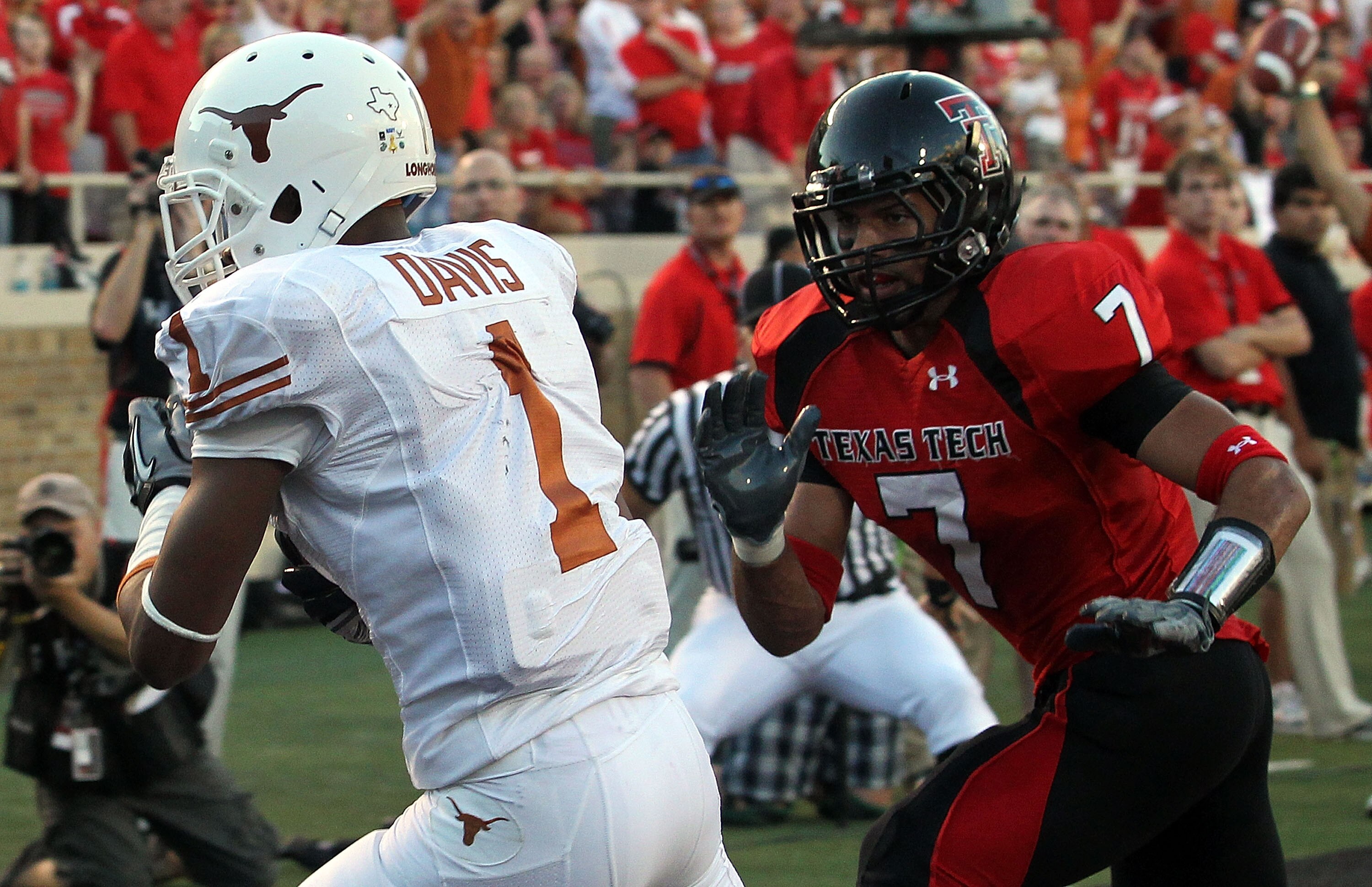 LUBBOCK, TX - SEPTEMBER 18:  Wide receiver Mike Davis #1 of the Texas Longhorns makes a touchdown pass reception against Will Ford #7 of the Texas Tech Red Raiders at Jones AT&T Stadium on September 18, 2010 in Lubbock, Texas.  (Photo by Ronald Martinez/G