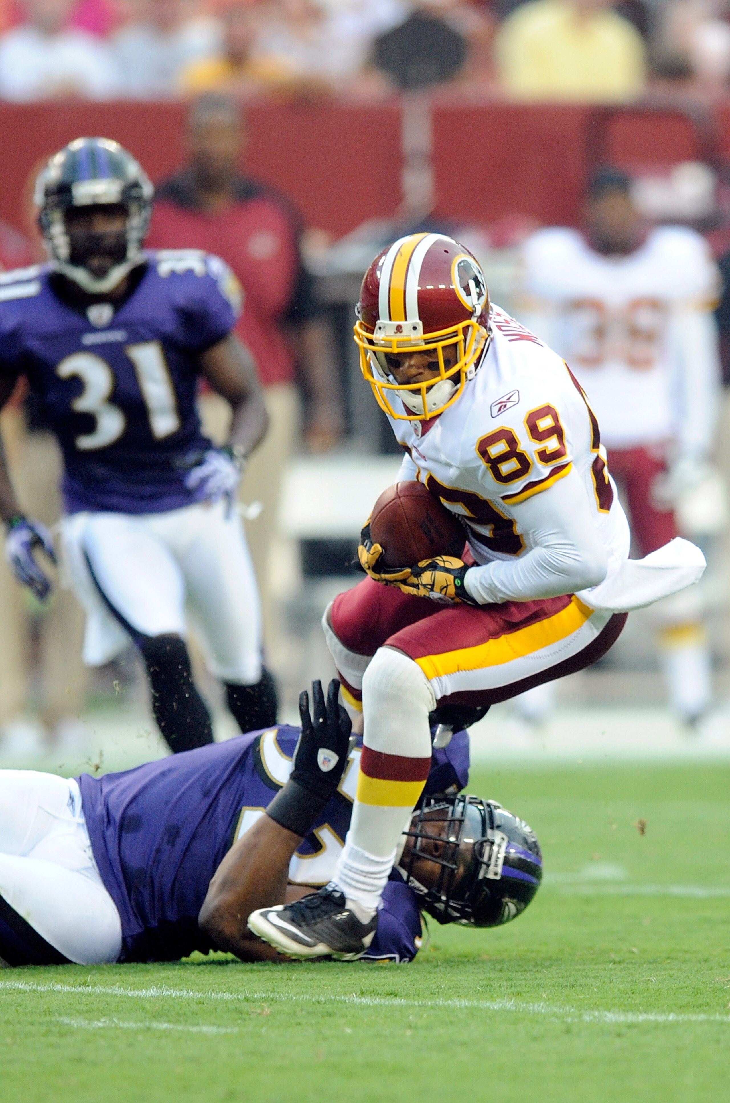 LANDOVER, MD - AUGUST 21: Santana Moss #89 of the Washington Redskins is tackled during the preseason game by Ray Lewis #52 of the Baltimore Ravens at FedExField on August 21, 2010 in Landover, Maryland. (Photo by Greg Fiume/Getty Images) LANDOVER, MD - AUGUST 21: Santana Moss #89 of the Washington Redskins is tackled during the preseason game by Ray Lewis #52 of the Baltimore Ravens at FedExField on August 21, 2010 in Landover, Maryland. (Photo by Greg Fiume/Getty Images)