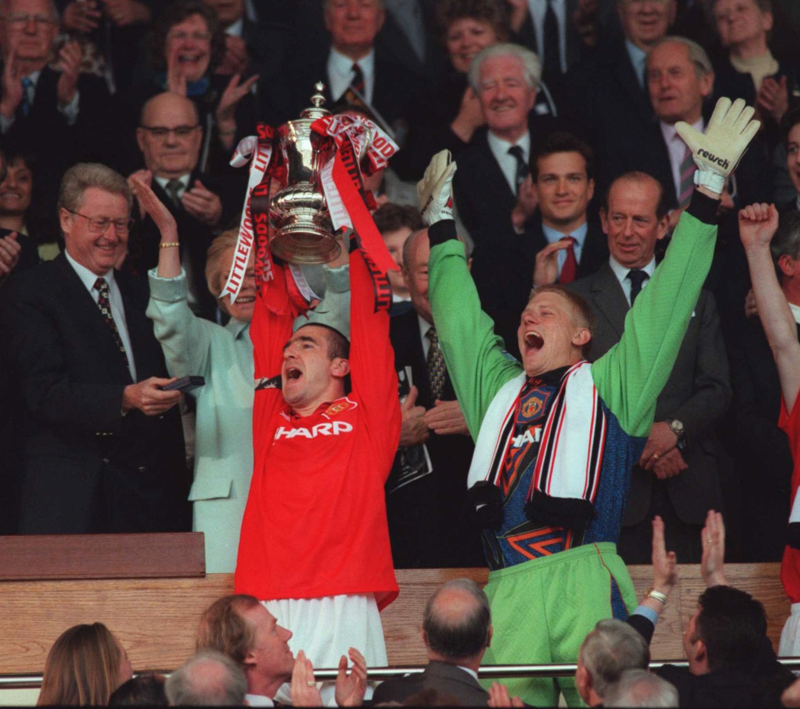 11 May 1996:  Eric Cantona and Peter Schmeichel celebrates with the trophy after Manchester United's victory over Liverpool in the 1996 FA Cup Final between Manchester United v Liverpool at Wembley Stadium, London. Mandatory Credit: Shaun Botterill/ALLSPO