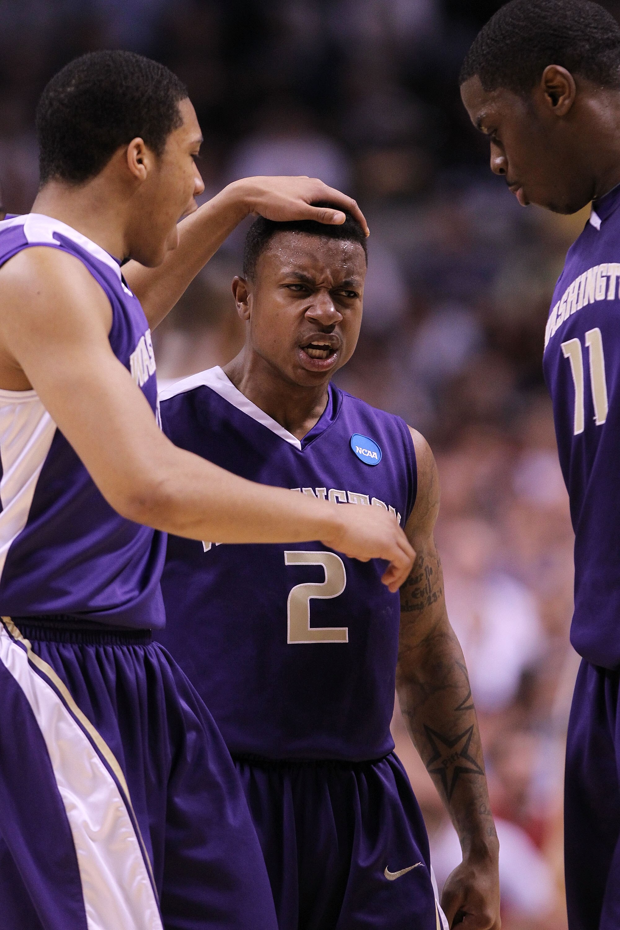 SAN JOSE, CA - MARCH 20:  Guard Isaiah Thomas #2 of the Washington Huskies celebrates with Matthew Bryan-Amaning #11 and Abdul Gaddy #10 after a three point basket to give the Huskies a 10 point lead against the New Mexico Lobos in the second round of the