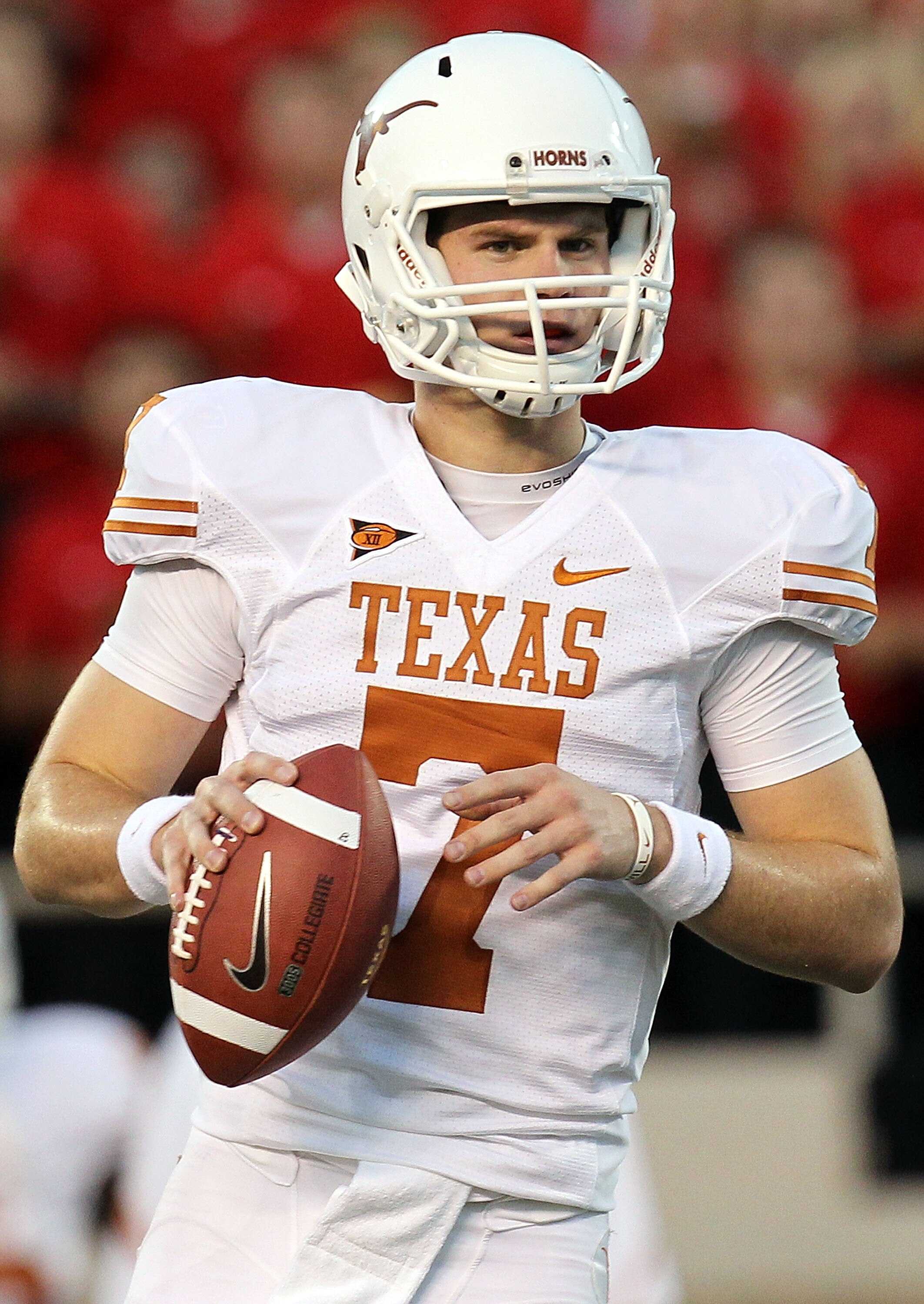 LUBBOCK, TX - SEPTEMBER 18:  Quarterback Garrett Gilbert #7 of the Texas Longhorns looks to pass against the Texas Tech Red Raiders at Jones AT&T Stadium on September 18, 2010 in Lubbock, Texas.  (Photo by Ronald Martinez/Getty Images)