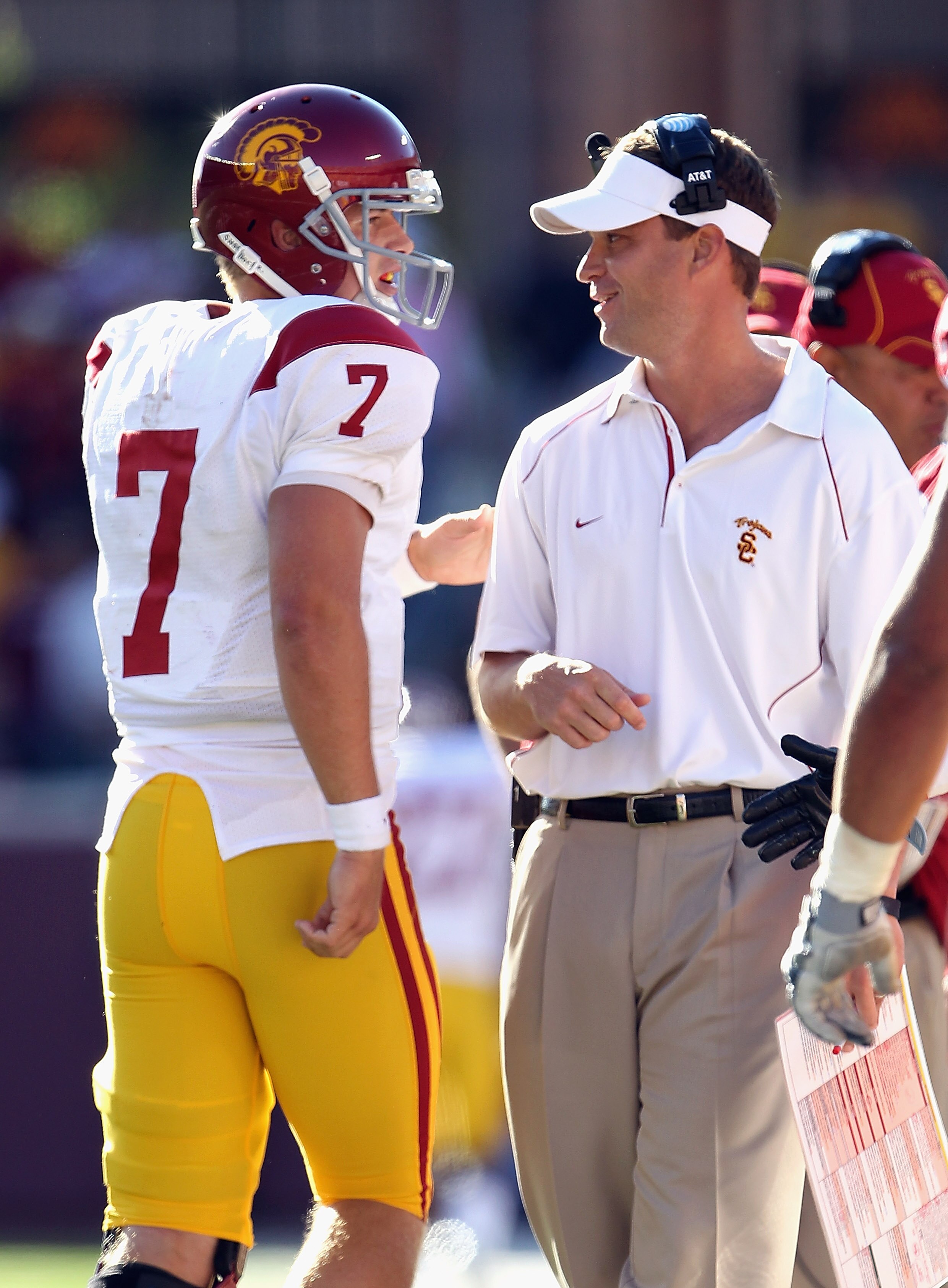MINNEAPOLIS - SEPTEMBER 18:  Head coach Lane Kiffin of the USC Trojans congratulates quarterback Matt Barkley #7 after a touchdown during the game against the Minnesota Golden Gophers on September 18, 2010 at TCF Bank Stadium in Minneapolis, Minnesota.  (