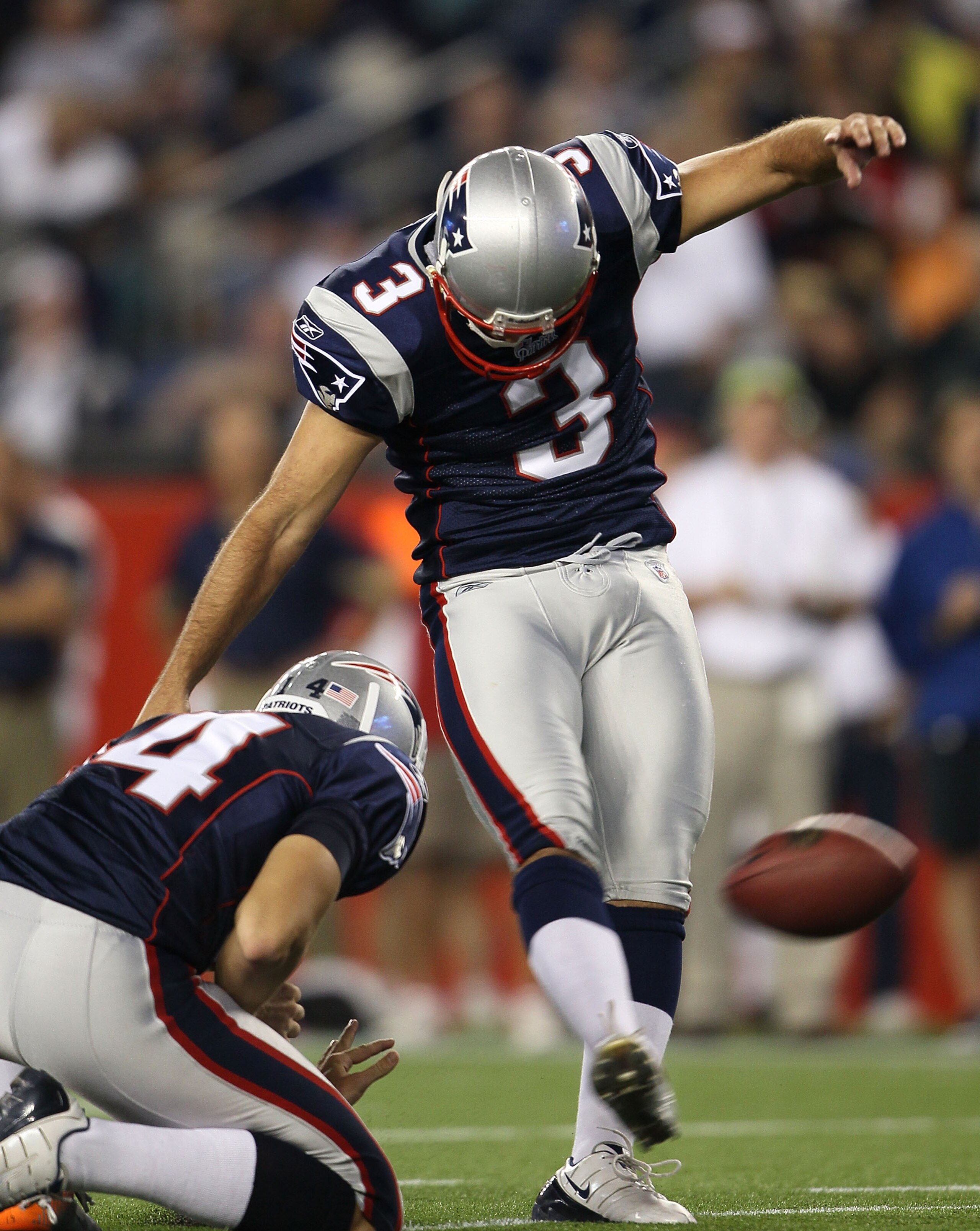 FOXBORO, MA - AUGUST 26:  Stephen Gostkowski #3 of the New England Patriots kicks as Zoltan Mesko #14 holds in the second half against the St. Louis Rams on August 26, 2010 at Gillette Stadium in Foxboro, Massachusetts. The Rams defeated the Patriots 36-3