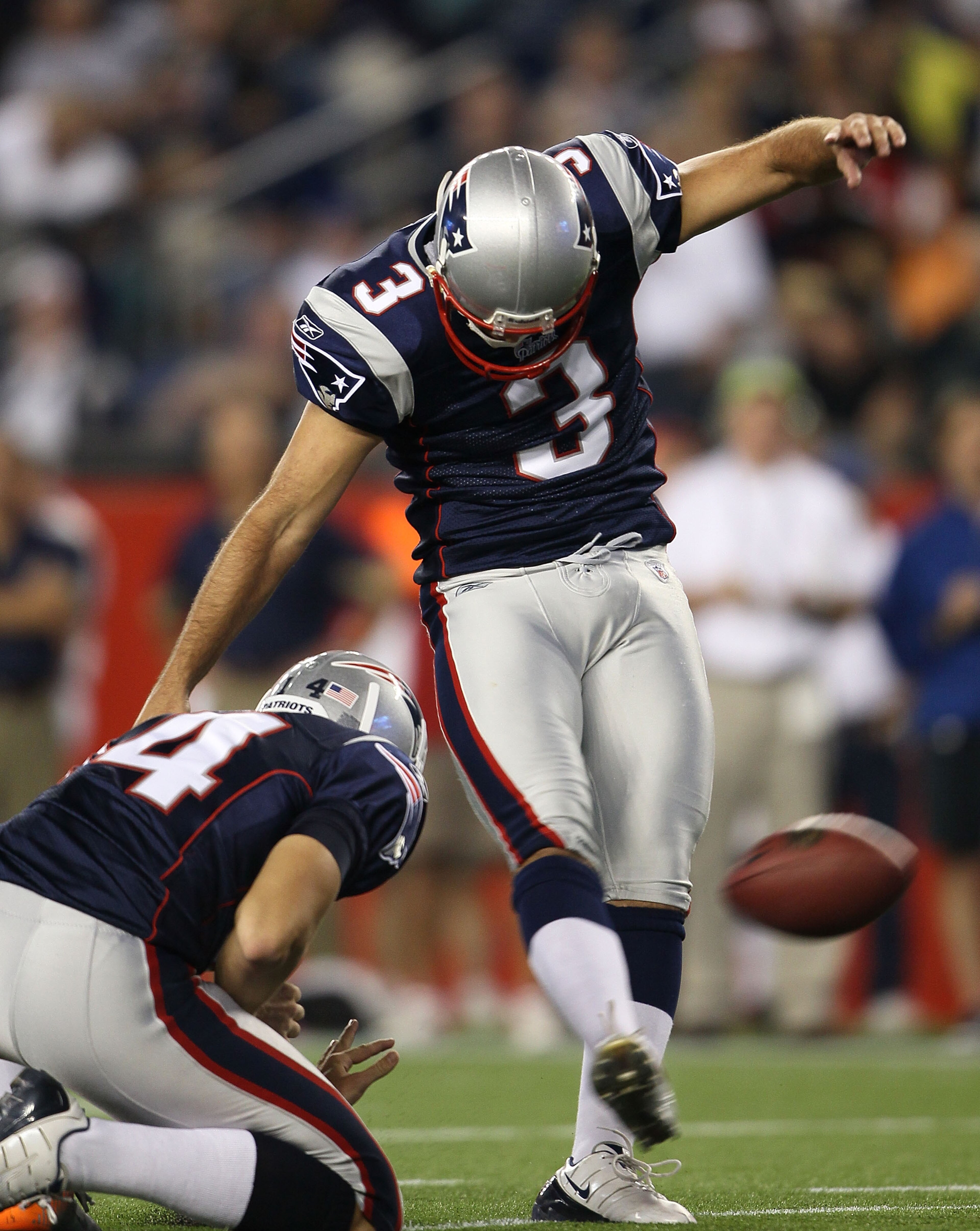 FOXBORO, MA - AUGUST 26:  Stephen Gostkowski #3 of the New England Patriots kicks as Zoltan Mesko #14 holds in the second half against the St. Louis Rams on August 26, 2010 at Gillette Stadium in Foxboro, Massachusetts. The Rams defeated the Patriots 36-3