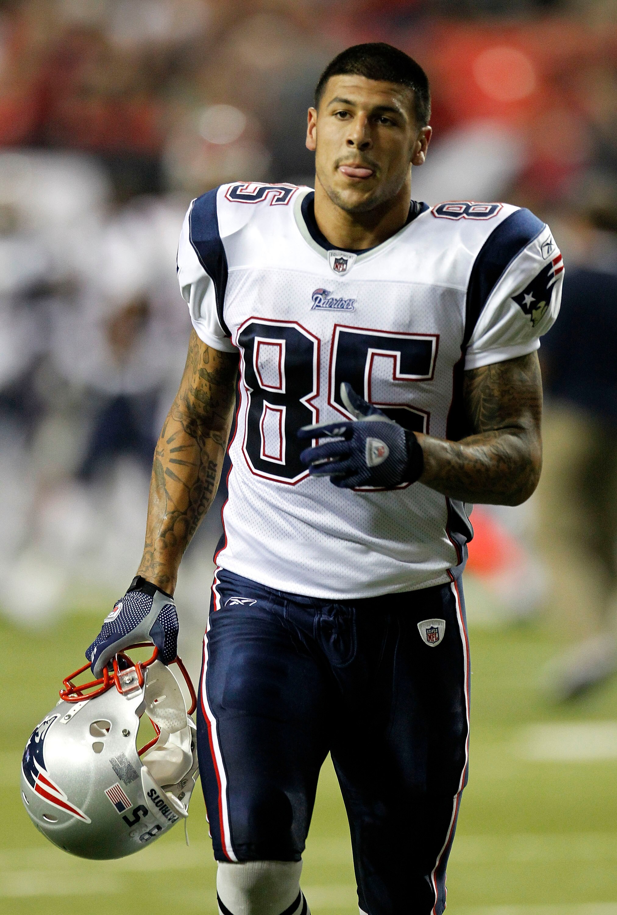 ATLANTA - AUGUST 19:  Tight end Aaron Hernandez #85 of the New England Patriots jogs off of the field during halftime during the preseason game against the Atlanta Falcons at the Georgia Dome on August 19, 2010 in Atlanta, Georgia.  (Photo by Mike Zarrill