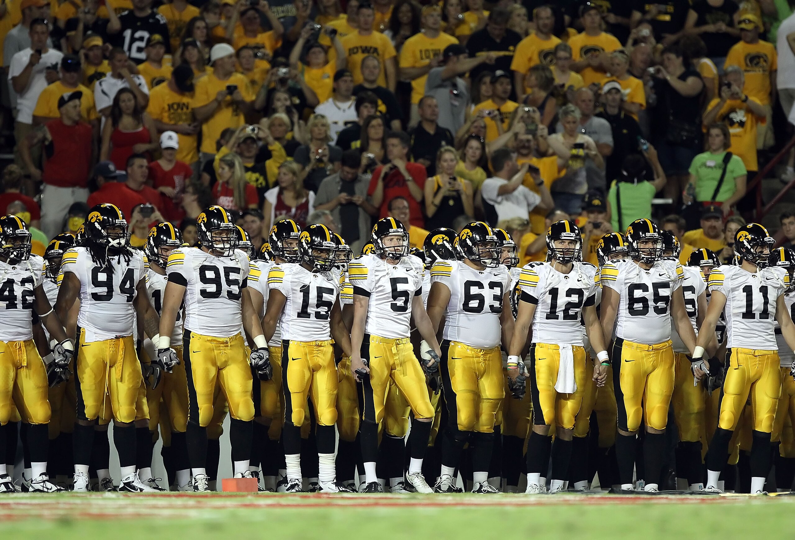 TUCSON, AZ - SEPTEMBER 18:  The Iowa Hawkeyes line up before the college football game against the Arizona Wildcats at Arizona Stadium on September 18, 2010 in Tucson, Arizona. The Wildcats defeated the Hawkeyes 34-27. (Photo by Christian Petersen/Getty I